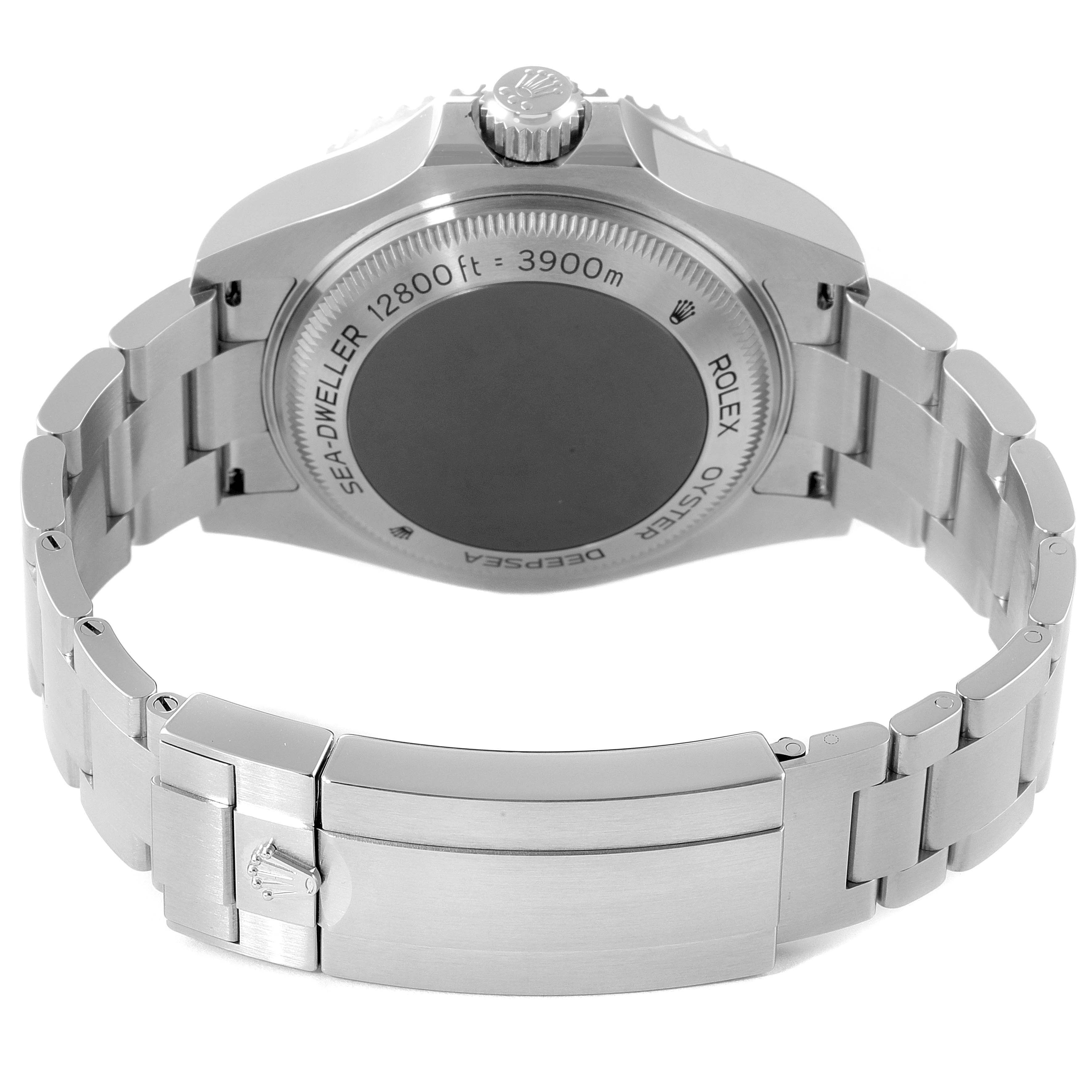 The image shows the back case and clasp of the Rolex Sea-Dweller 126660 Men
s Stainless Steel Black Dial 126660 Men
s Stainless Steel Black Dial watch, including part of its stainless steel bracelet.