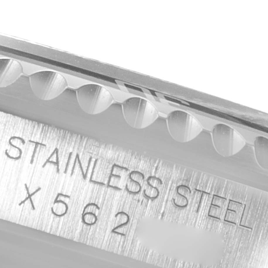 The image shows a close-up of the case side and bezel edge of a Rolex Submariner 14060 Men
s Stainless Steel Black Dial 14060 Men
s Stainless Steel Black Dial watch with engraving indicating stainless steel.