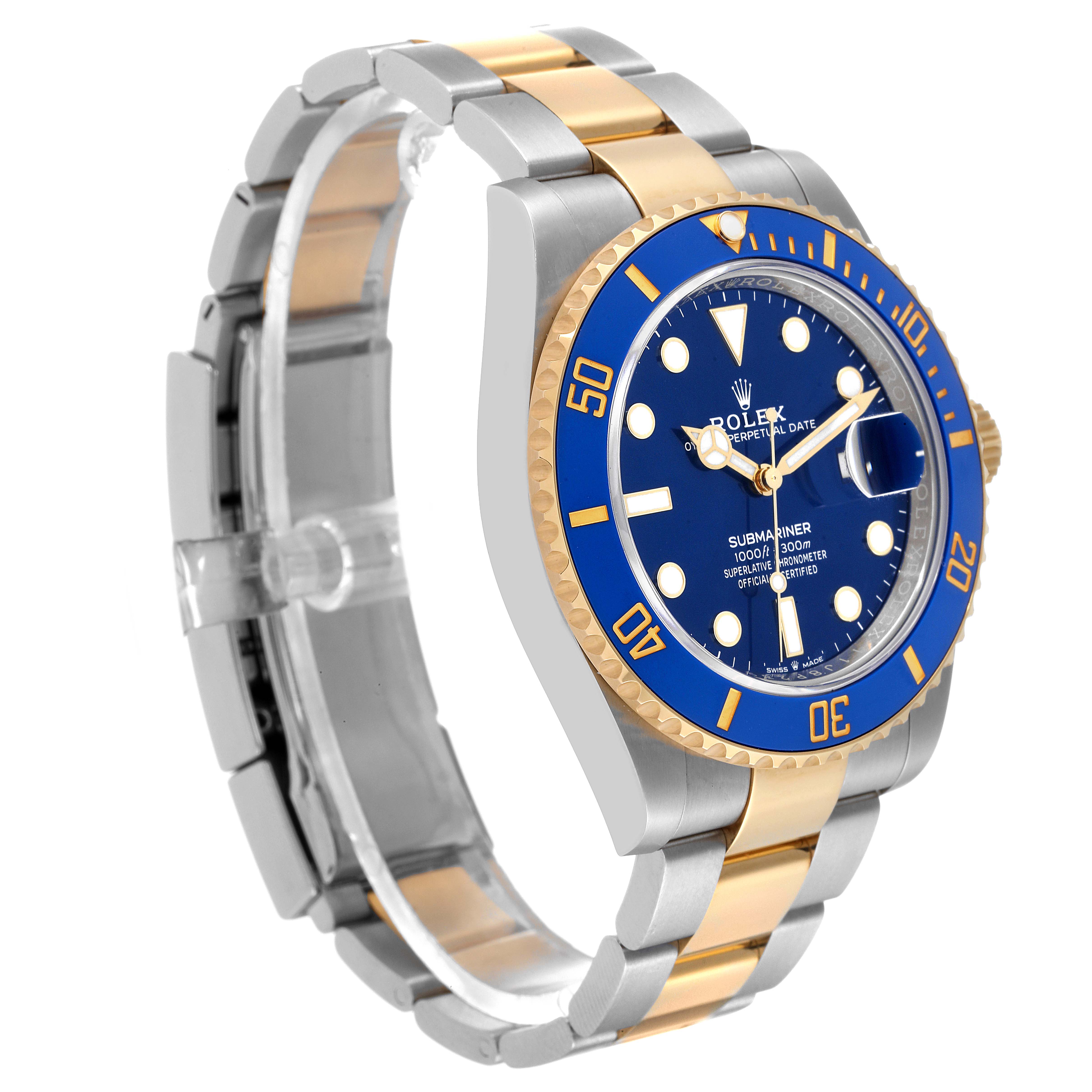 The image shows a Rolex Submariner 126613 Men's Steel and Gold (two tone) Blue Dial 126613 Men's Steel and Gold (two tone) Blue Dial watch from a front-side angle, highlighting the blue dial, bezel, and two-tone bracelet.