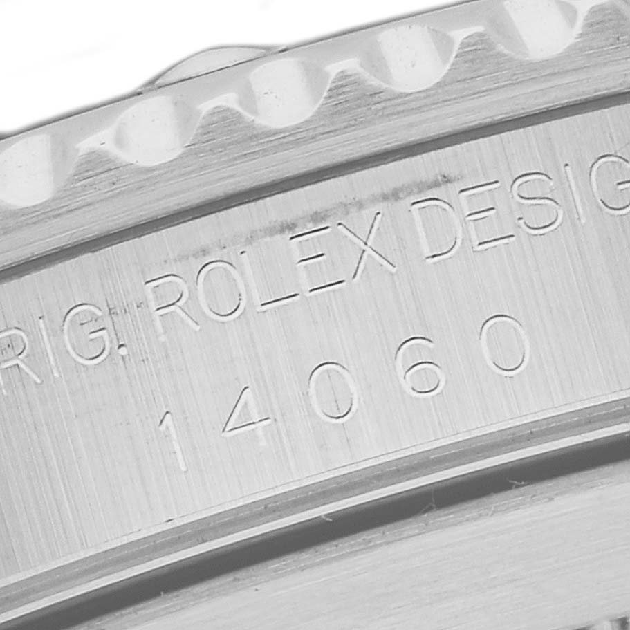 This image shows a close-up of the engraved case side of a Rolex Submariner 14060 Men
s Stainless Steel Black Dial 14060 Men
s Stainless Steel Black Dial, highlighting the model number and the brand name.
