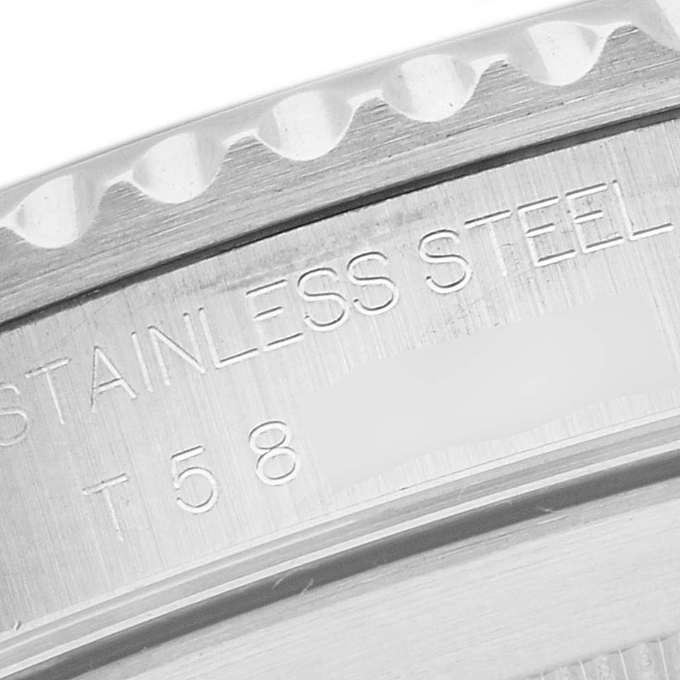 This image shows a close-up of the case back of a Rolex Submariner 14060 Men
s Stainless Steel Black Dial 14060 Men
s Stainless Steel Black Dial, highlighting the stainless steel material and engraved text.