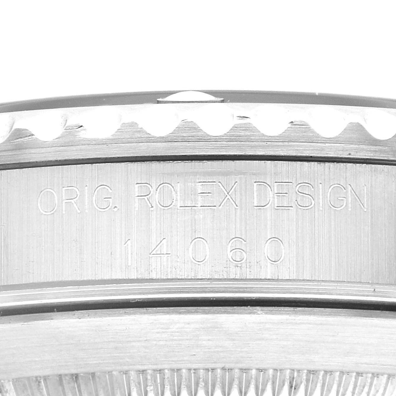 This close-up image shows the side engraving and bezel of a Rolex Submariner 14060 Men
s Stainless Steel Black Dial 14060 Men
s Stainless Steel Black Dial model.