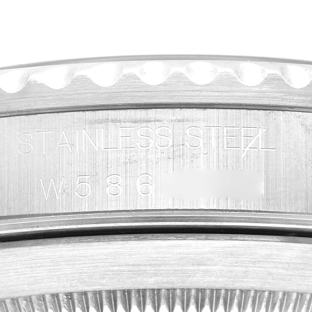 The image shows an engraved stainless steel part of the Rolex Submariner 14060 Men
s Stainless Steel Black Dial 14060 Men
s Stainless Steel Black Dial watch with its serial number partially visible.