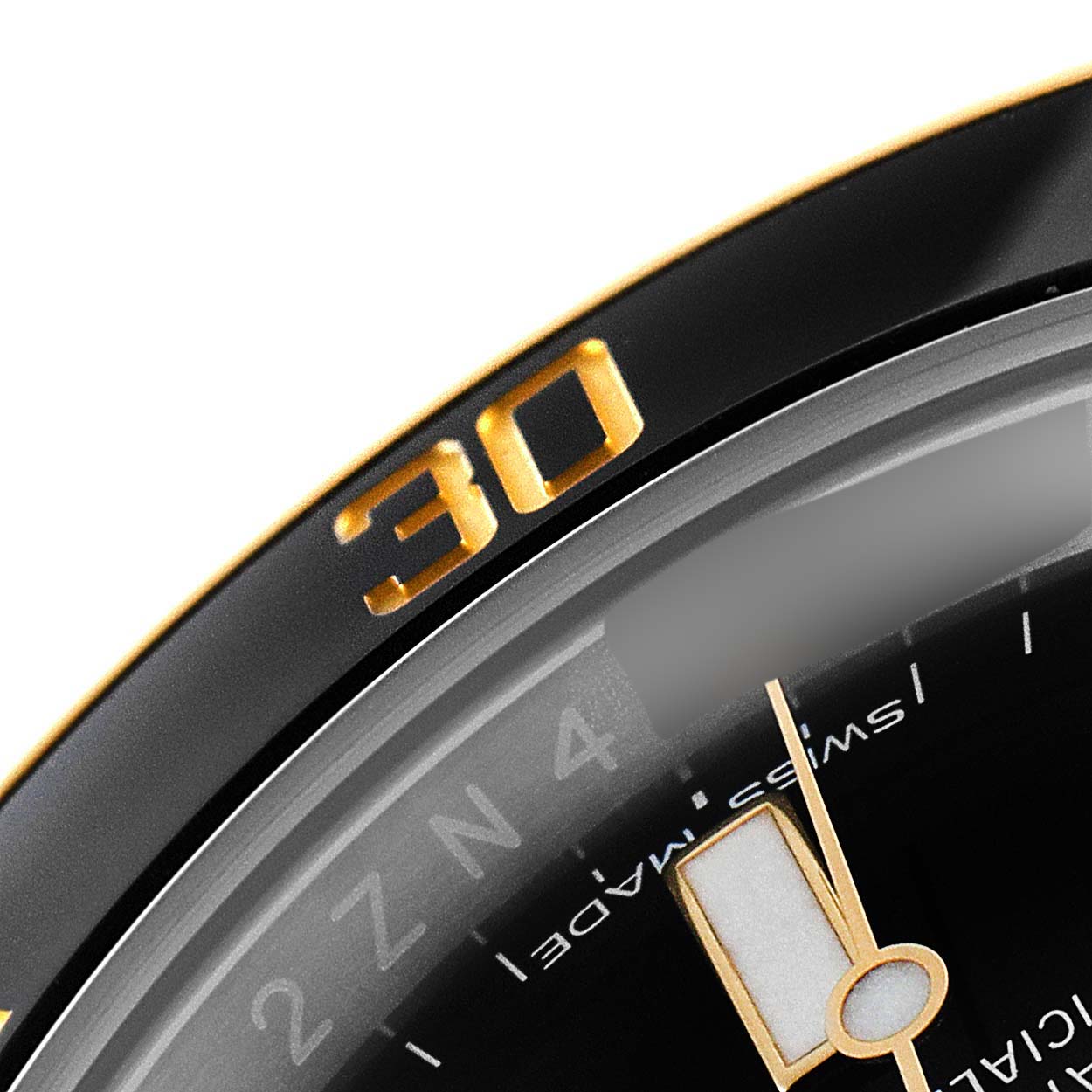 This close-up image of the Rolex Submariner 116613 Men's Steel and Gold (two tone) Black Dial 116613 Men's Steel and Gold (two tone) Black Dial watch shows part of the bezel and dial, including the "30" mark.