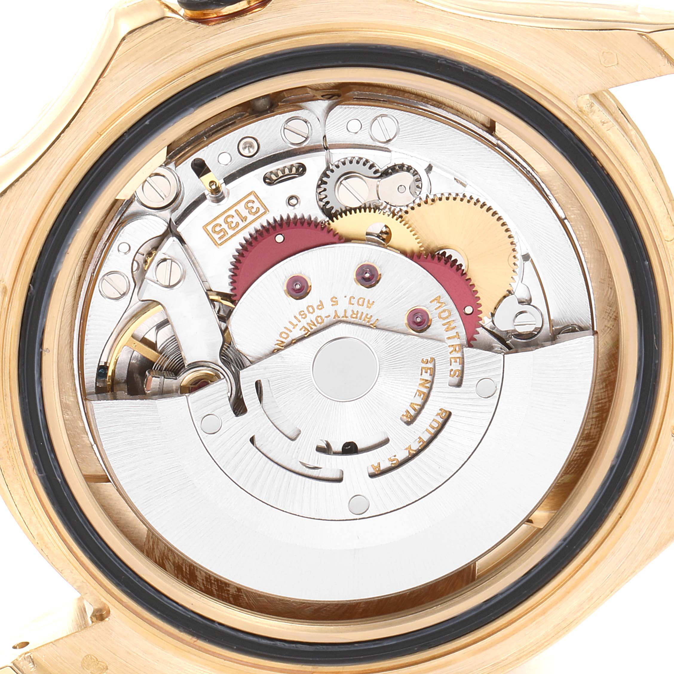 The image shows the internal mechanism of a Rolex Yacht-Master 16628 Men's Yellow Gold White Dial 16628 Men's Yellow Gold White Dial watch from the back, highlighting its intricate gears and components.