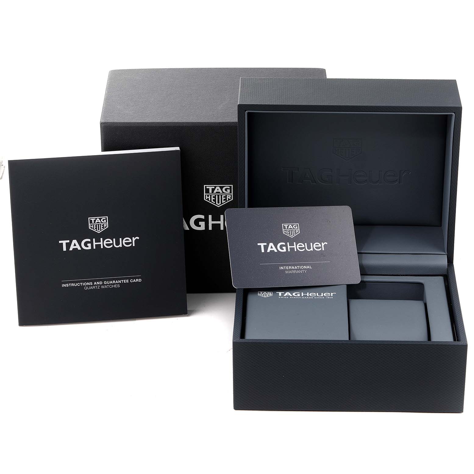 The image shows the Tag Heuer Monaco WAW131E.FC6420 Men's Stainless Steel Brown Dial WAW131E.FC6420 Men's Stainless Steel Brown Dial watch's packaging, including the box, instruction manual, and warranty card.