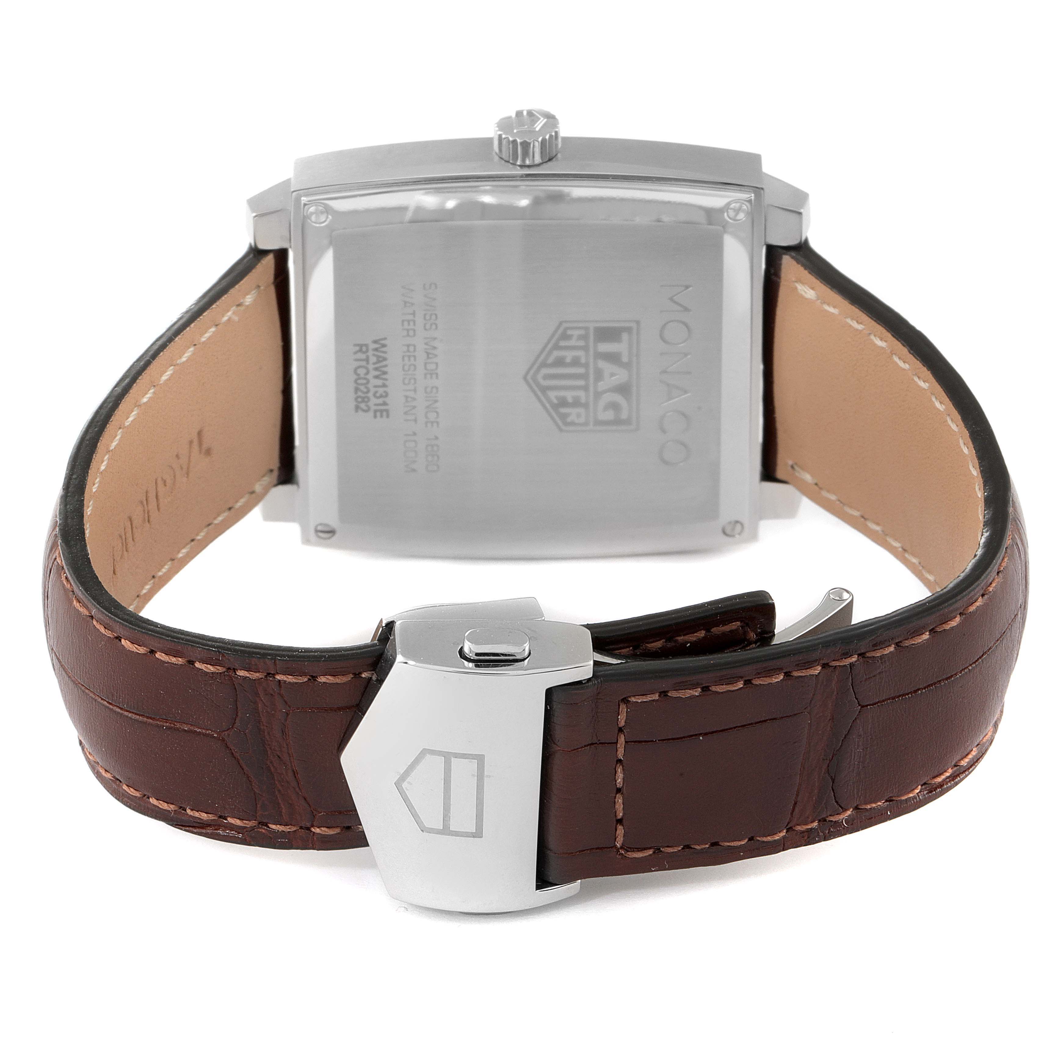 This image shows the back view of a Tag Heuer Monaco WAW131E.FC6420 Men's Stainless Steel Brown Dial WAW131E.FC6420 Men's Stainless Steel Brown Dial watch, featuring its case back and brown leather strap.