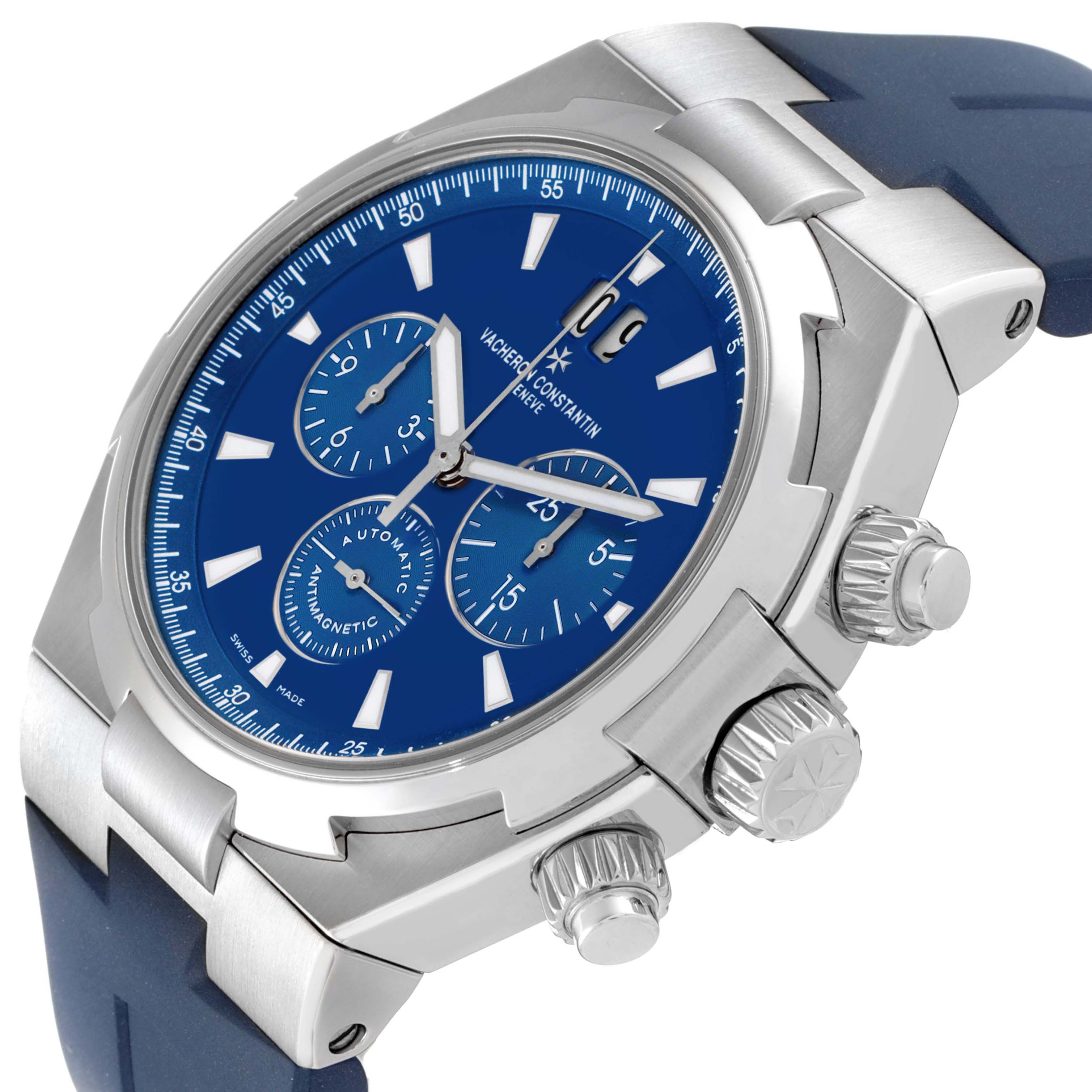 The Vacheron Constantin Overseas 49150/000A-9745 Men's Stainless Steel Blue Dial watch is shown from a side angle, highlighting the blue dial, chronograph subdials, and pushers.