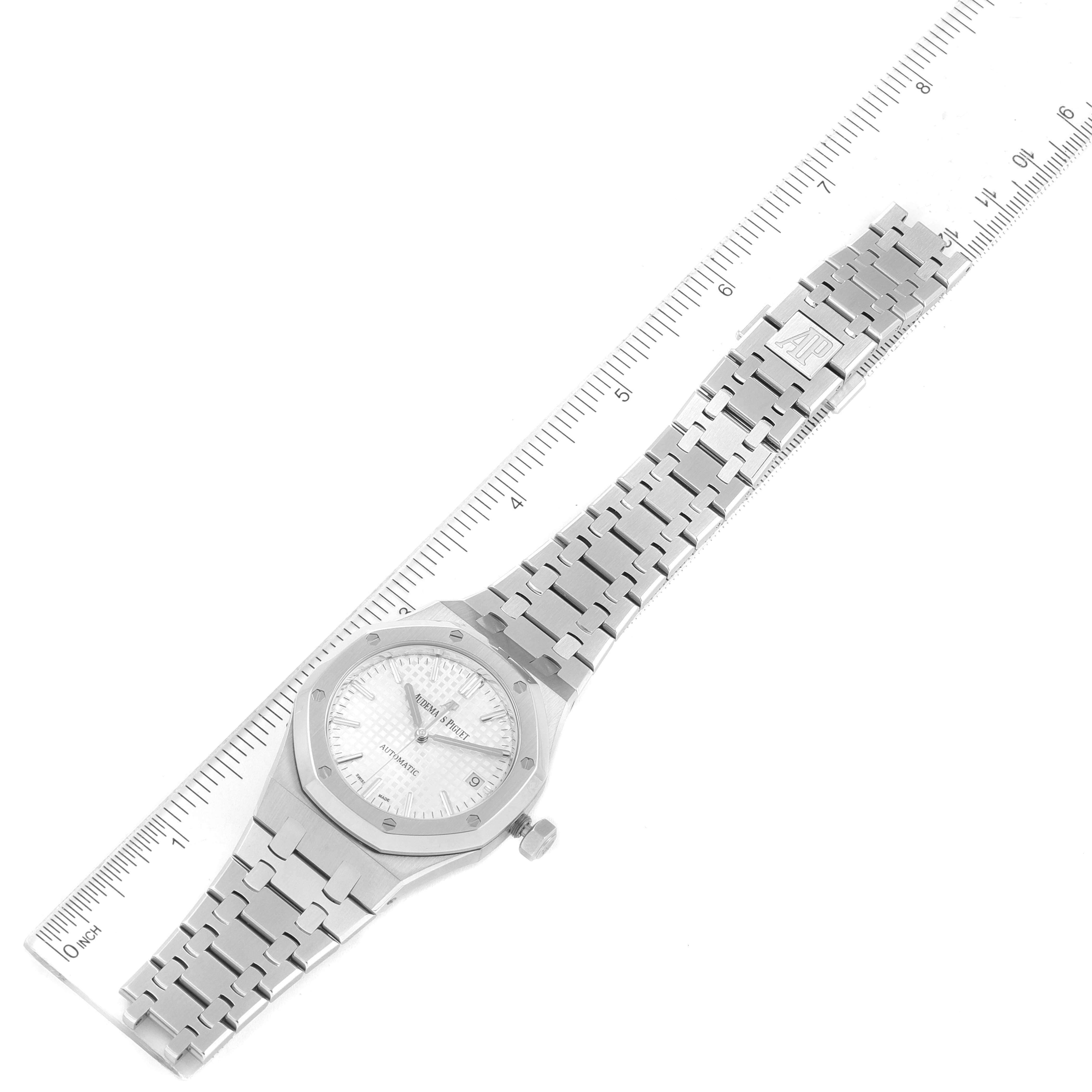 The Audemars Piguet Royal Oak 15450ST.OO.1256ST.01 Men's Stainless Steel Silver Dial 15450ST.OO.1256ST.01 Men's Stainless Steel Silver Dial watch is shown from a top-down angle, including the full face, bracelet, and ruler for measurement.