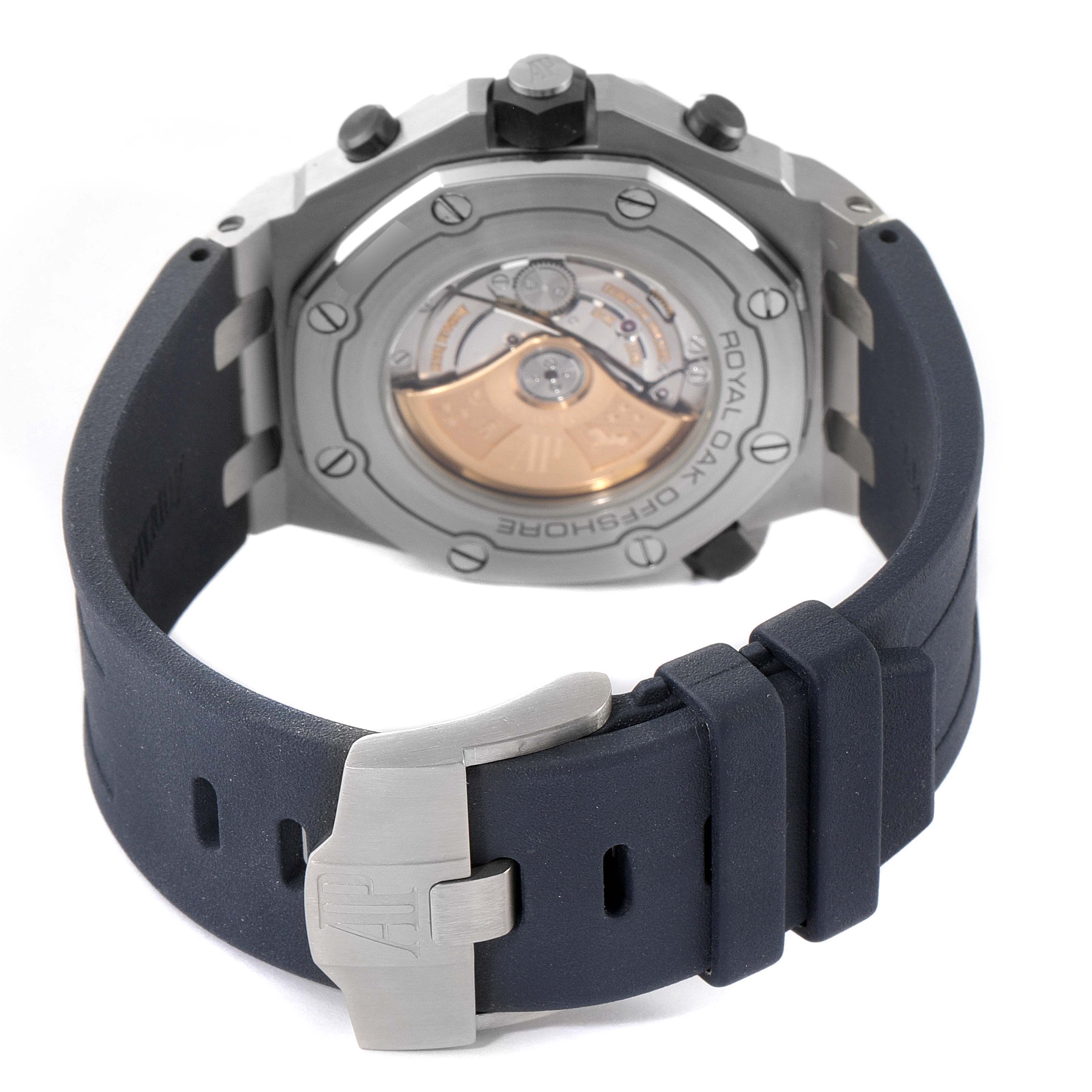 The image shows the back view of the Audemars Piguet Royal Oak Offshore 26703ST.OO.A027CA.01 Men's Stainless Steel Blue Dial 26703ST.OO.A027CA.01 Men's Stainless Steel Blue Dial watch, highlighting the movement and the rubber strap with its clasp.