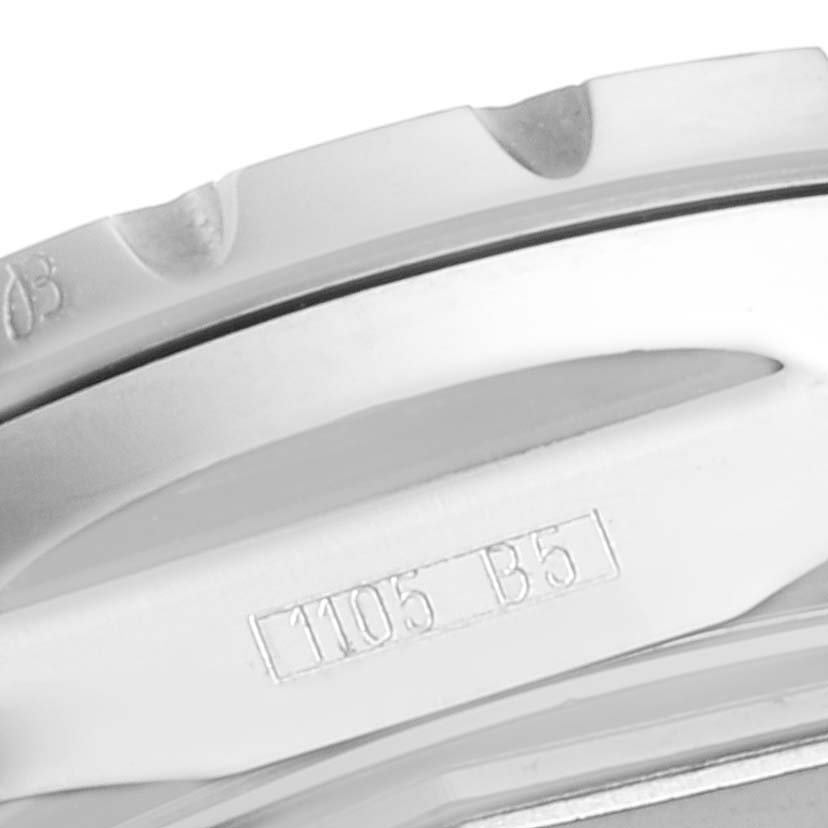 The image shows a close-up of the bezel and case side of a Breitling Chronomatic A41360 Men's Stainless Steel Silver Dial A41360 Men's Stainless Steel Silver Dial watch, featuring numbers and notches.