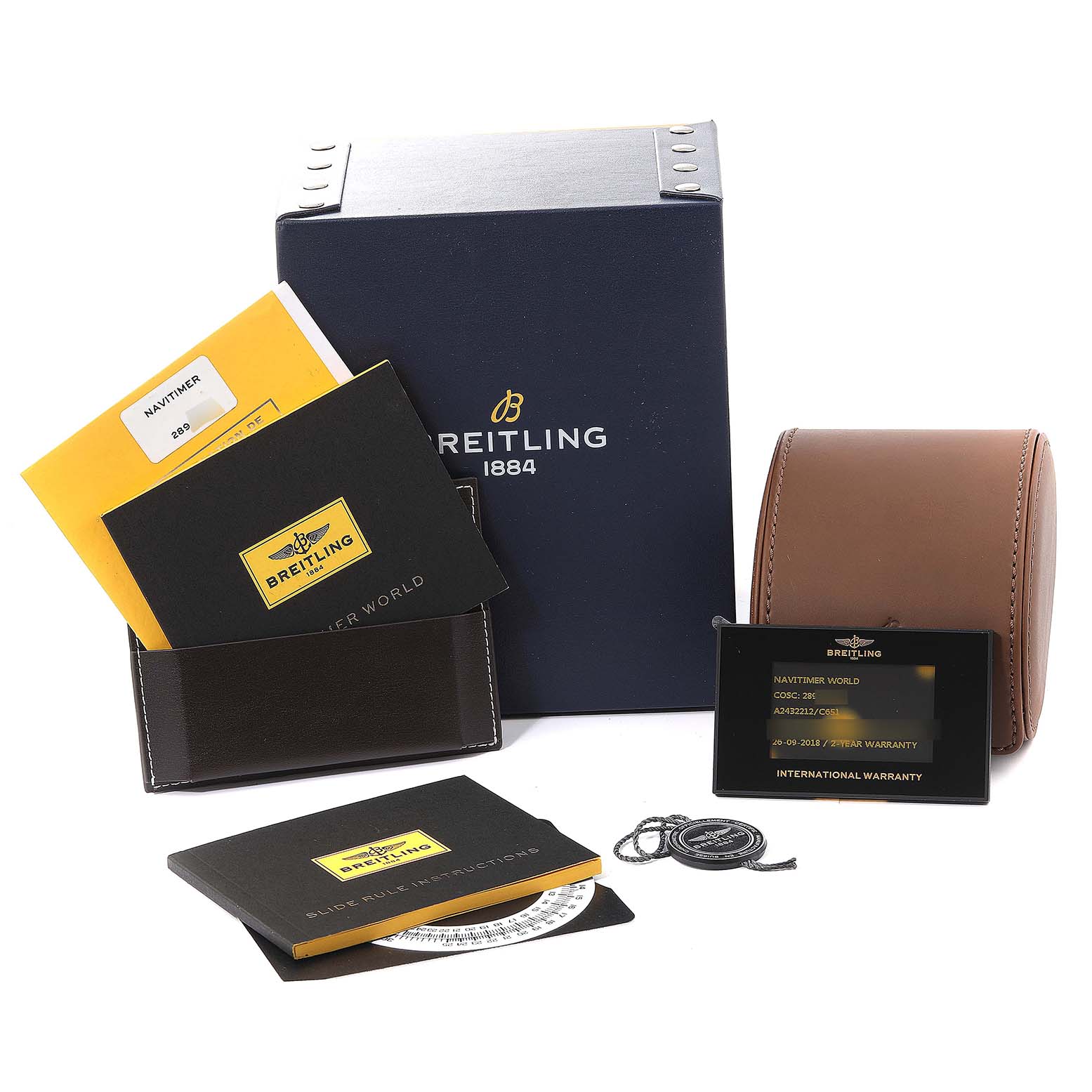 The image shows the box, manuals, warranty card, and other accessories for a Breitling Navitimer A2432212/C651 Men's Stainless Steel Blue Dial A2432212/C651 Men's Stainless Steel Blue Dial watch.