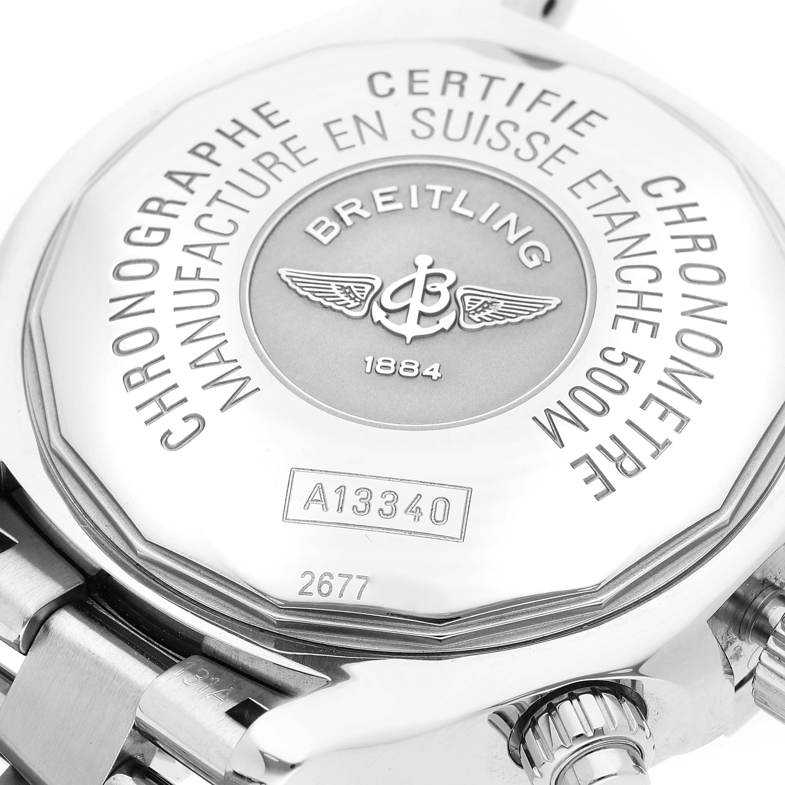 The image shows the back case of a Breitling Superocean A13340 Men's Stainless Steel Black Dial A13340 Men's Stainless Steel Black Dial watch, highlighting the engraved details and part of the bracelet.