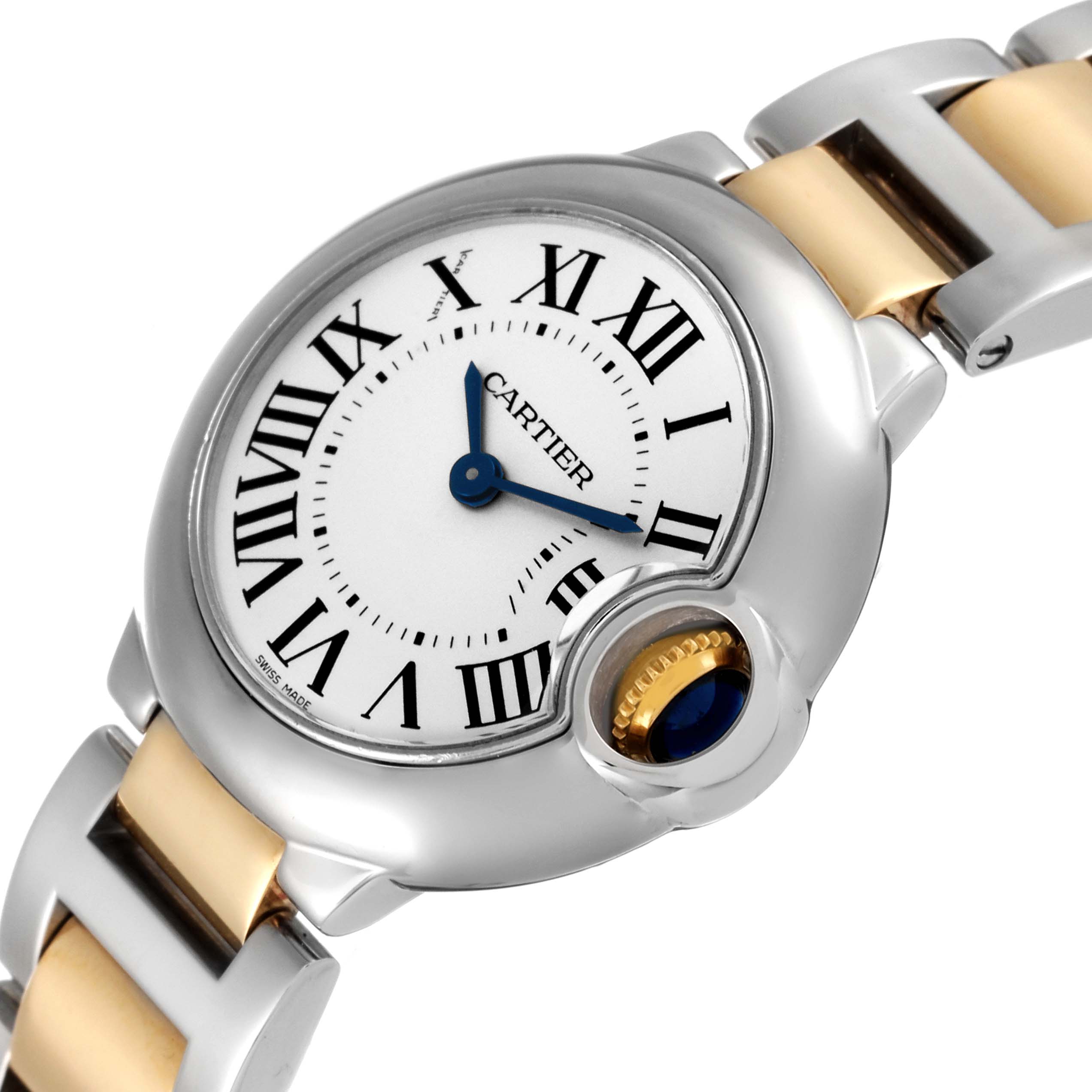 The image shows a close-up angle of the Ballon Bleu by Cartier, highlighting its face, crown, and part of the two-tone bracelet.