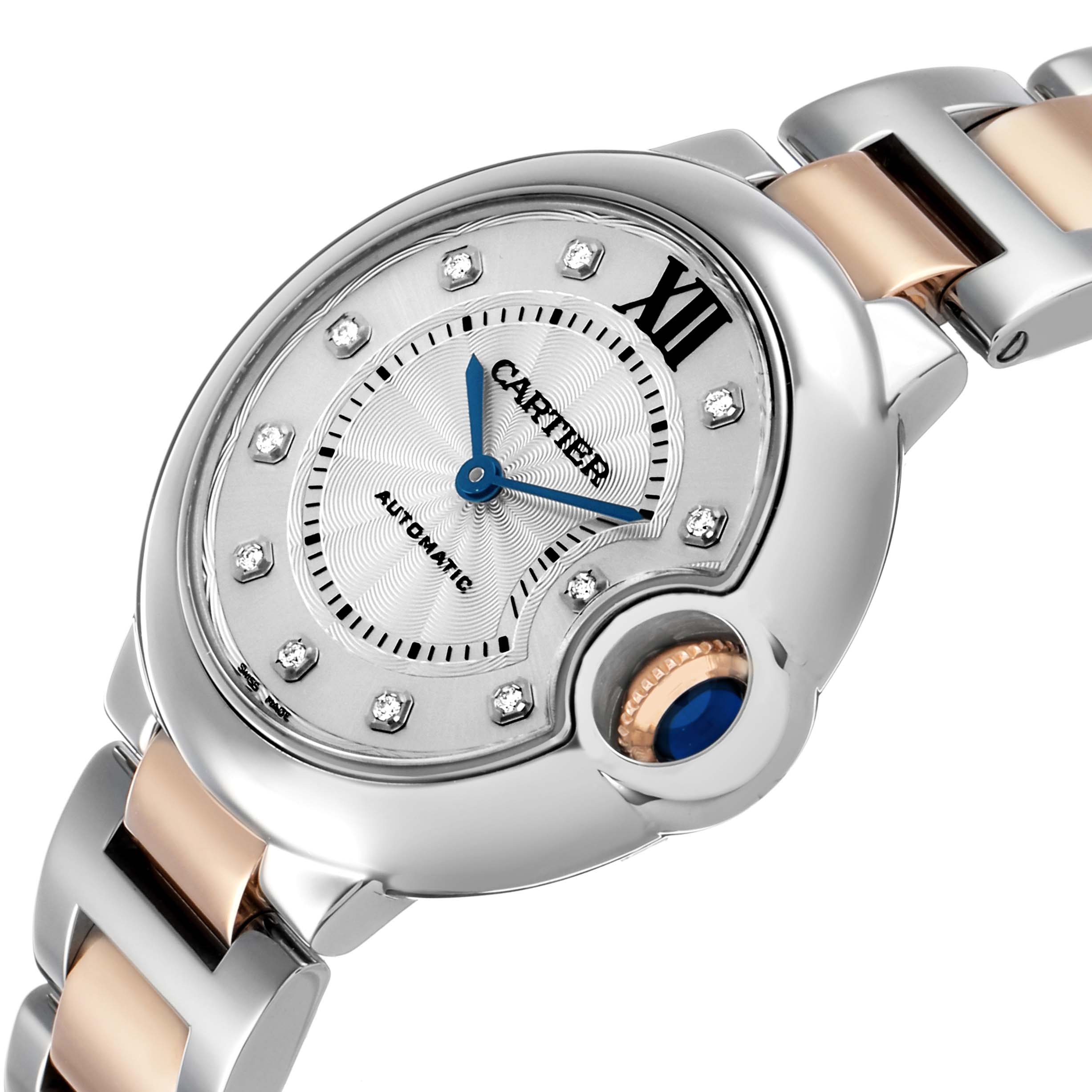 The Cartier Ballon Bleu WE902044 Women's Stainless Steel Silver Dial watch is shown at an angled view, highlighting the dial, crown, and part of the two-tone bracelet.