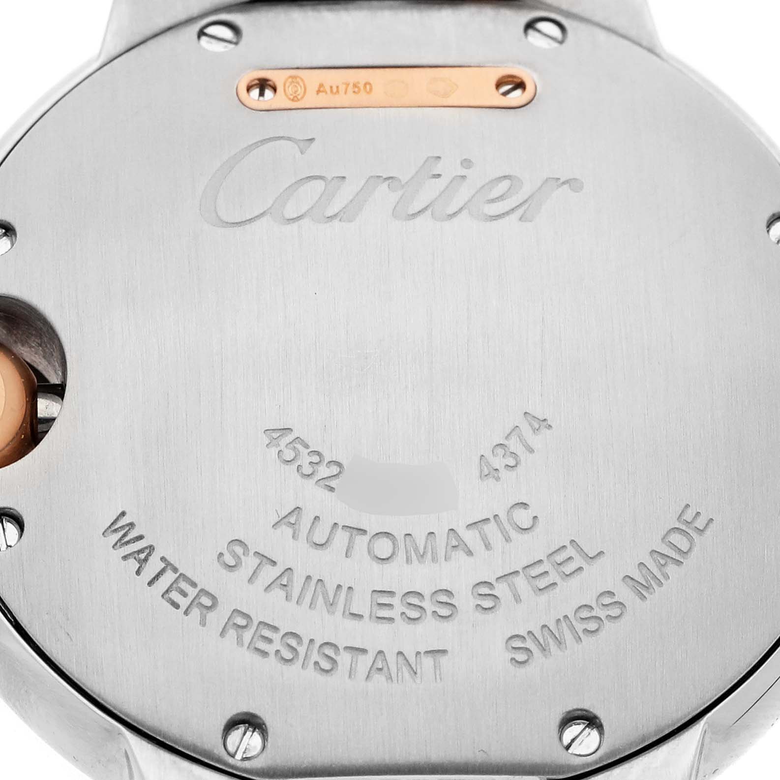 The image shows the back case of a Cartier Ballon Bleu W2BB0032 Women's Steel and Gold (two tone) Silver Dial watch with engraved details and screws.