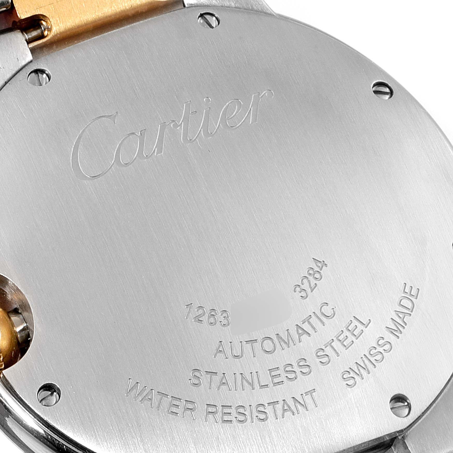 The image shows the back case of a Cartier Ballon Bleu W2BB0012 Men's Steel and Gold (two tone) Silver Dial W2BB0012 Men's Steel and Gold (two tone) Silver Dial watch, highlighting the engraving and material details.