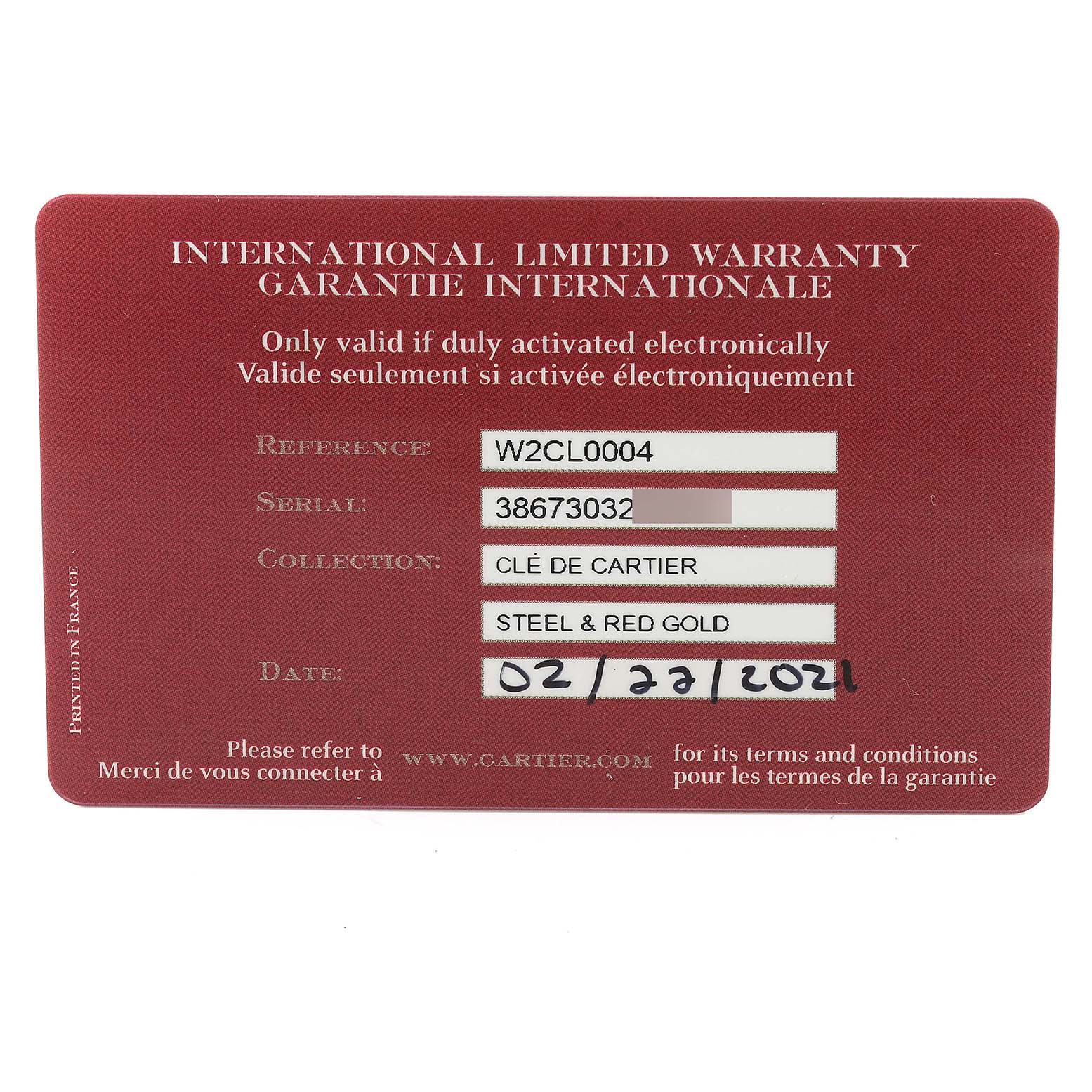 This image shows the international limited warranty card for the Clé de Cartier watch model by Cartier.