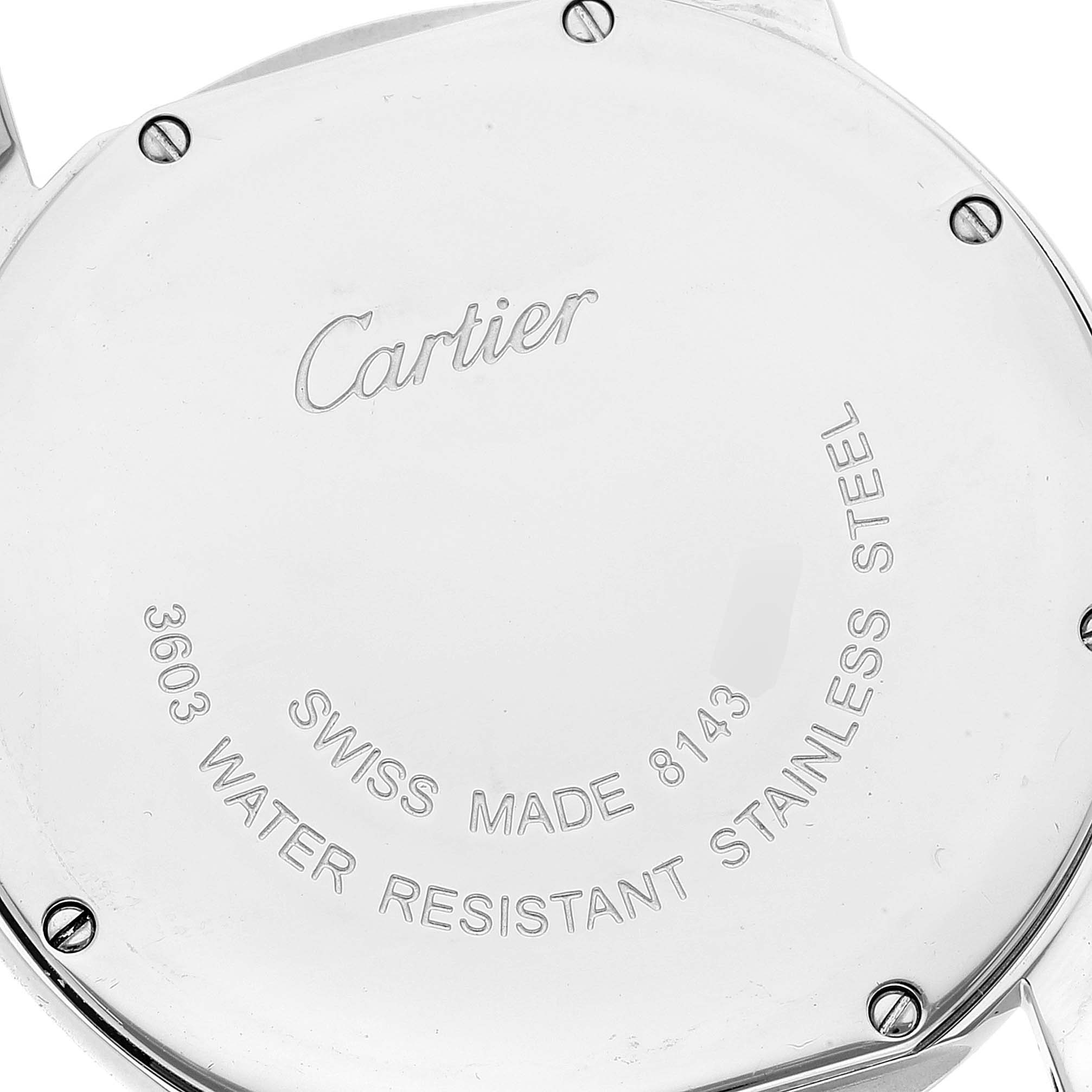 The image shows the case back of a Cartier Ronde W6700255 Men's Stainless Steel Silver Dial W6700255 Men's Stainless Steel Silver Dial model watch, displaying its engravings and screws.