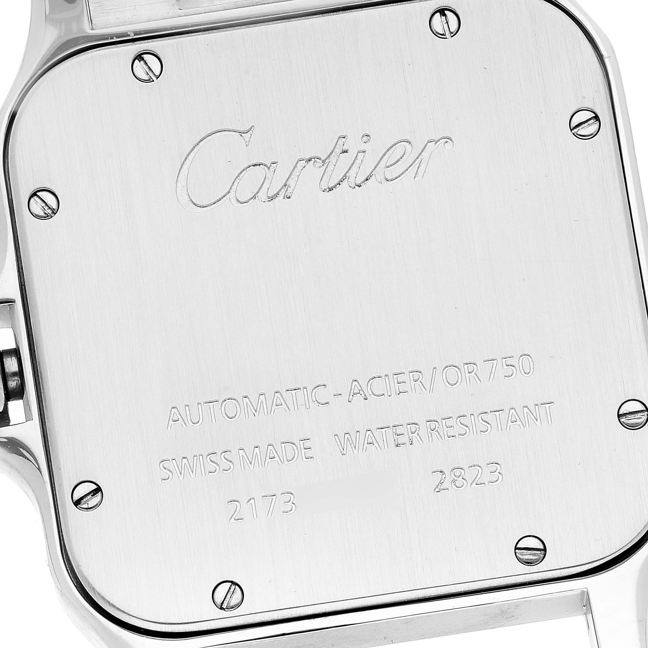 This image shows the case back of a Santos model by Cartier, featuring engravings and screws.