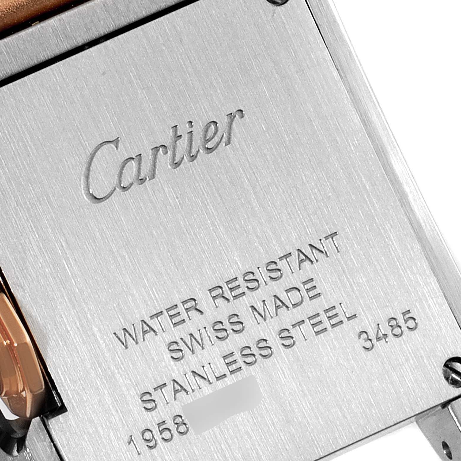 The image shows the back of a Cartier Tank Anglaise W5310036 Women's Stainless Steel Silver Dial W5310036 Women's Stainless Steel Silver Dial watch, including engravings with branding and specifications.