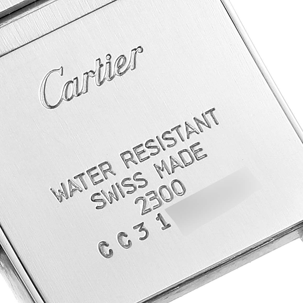 The image shows the back case of a Cartier Tank Française watch with engraved details including water resistance and model information.