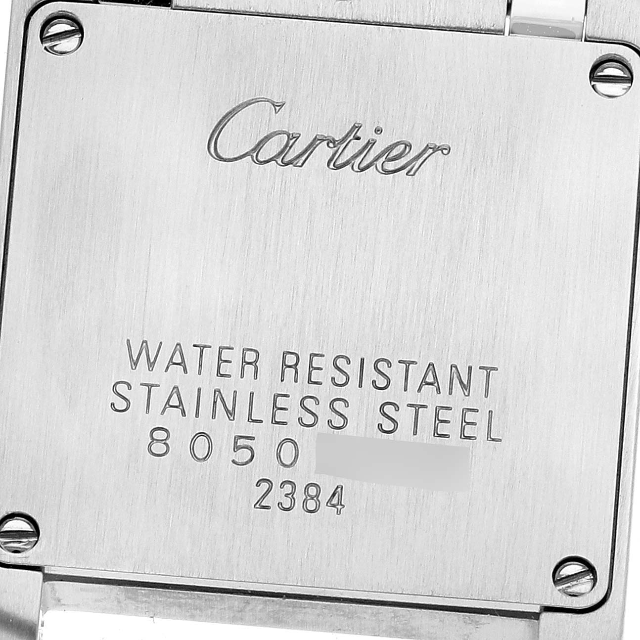 This image shows the back of a Tank Française watch by Cartier, displaying its water resistance and material details.