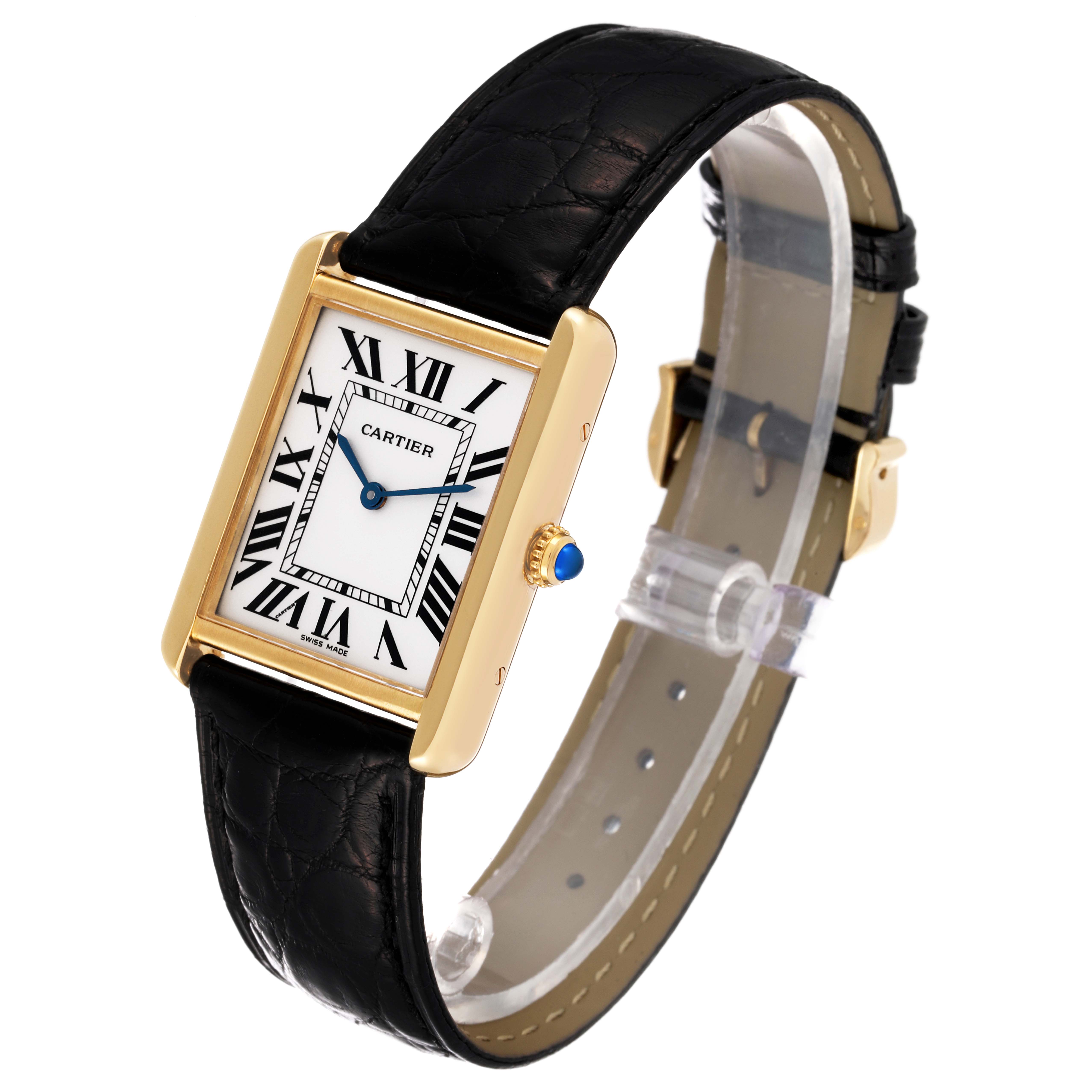 The image shows a Cartier Tank Solo W5200004 Men's Yellow Gold Silver Dial W5200004 Men's Yellow Gold Silver Dial watch at an angle showcasing its face, gold casing, black leather strap, and crown with a blue gem.