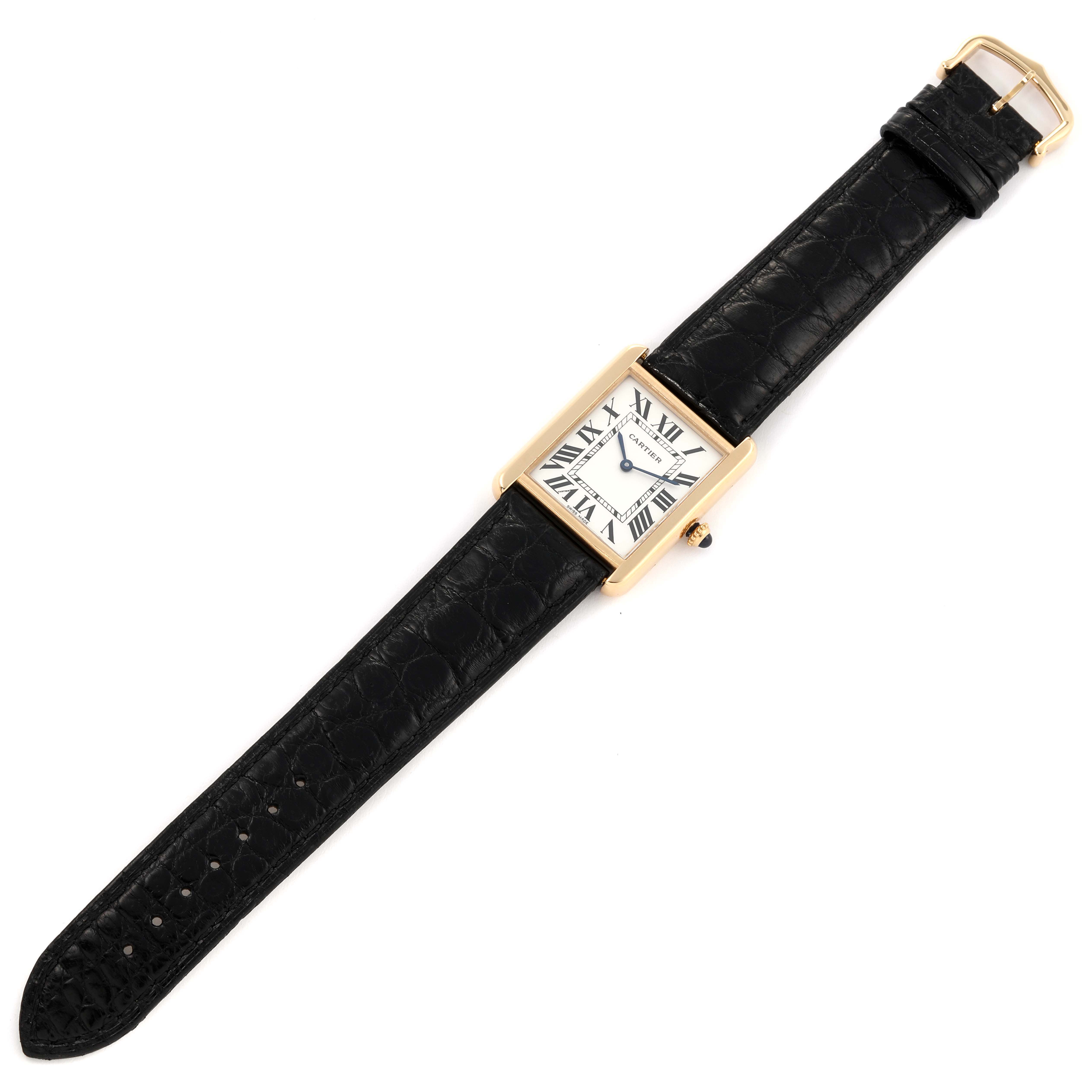 The image shows a bird's-eye view of a Cartier Tank Solo W5200004 Men's Yellow Gold Silver Dial W5200004 Men's Yellow Gold Silver Dial watch with a rectangular face and black leather strap.