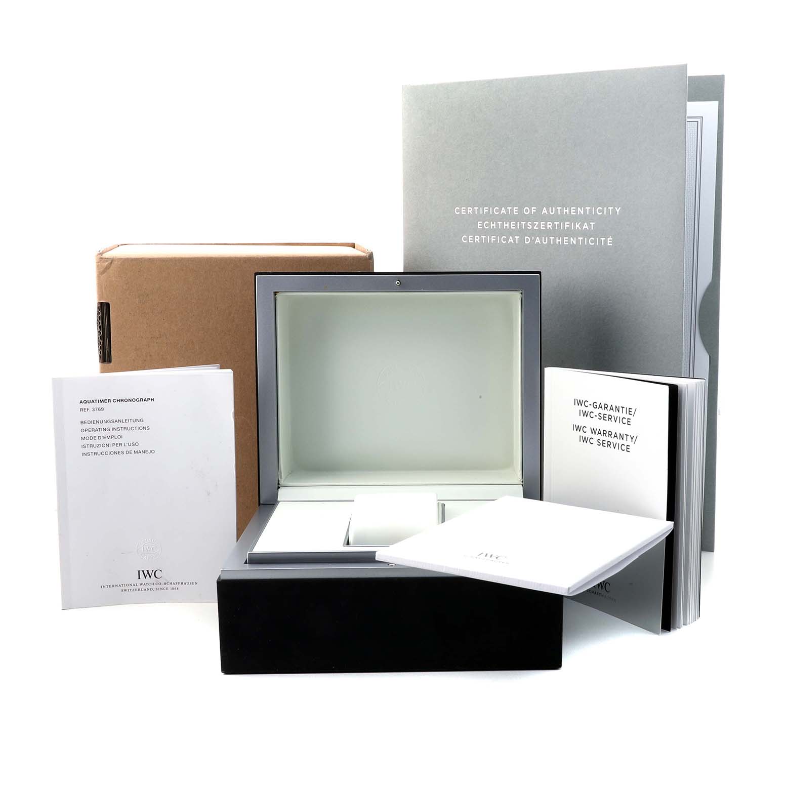 The image shows an IWC Aquatimer IW376903 Men's Rose Gold Black Dial watch box, along with the certificate of authenticity and instruction manuals.