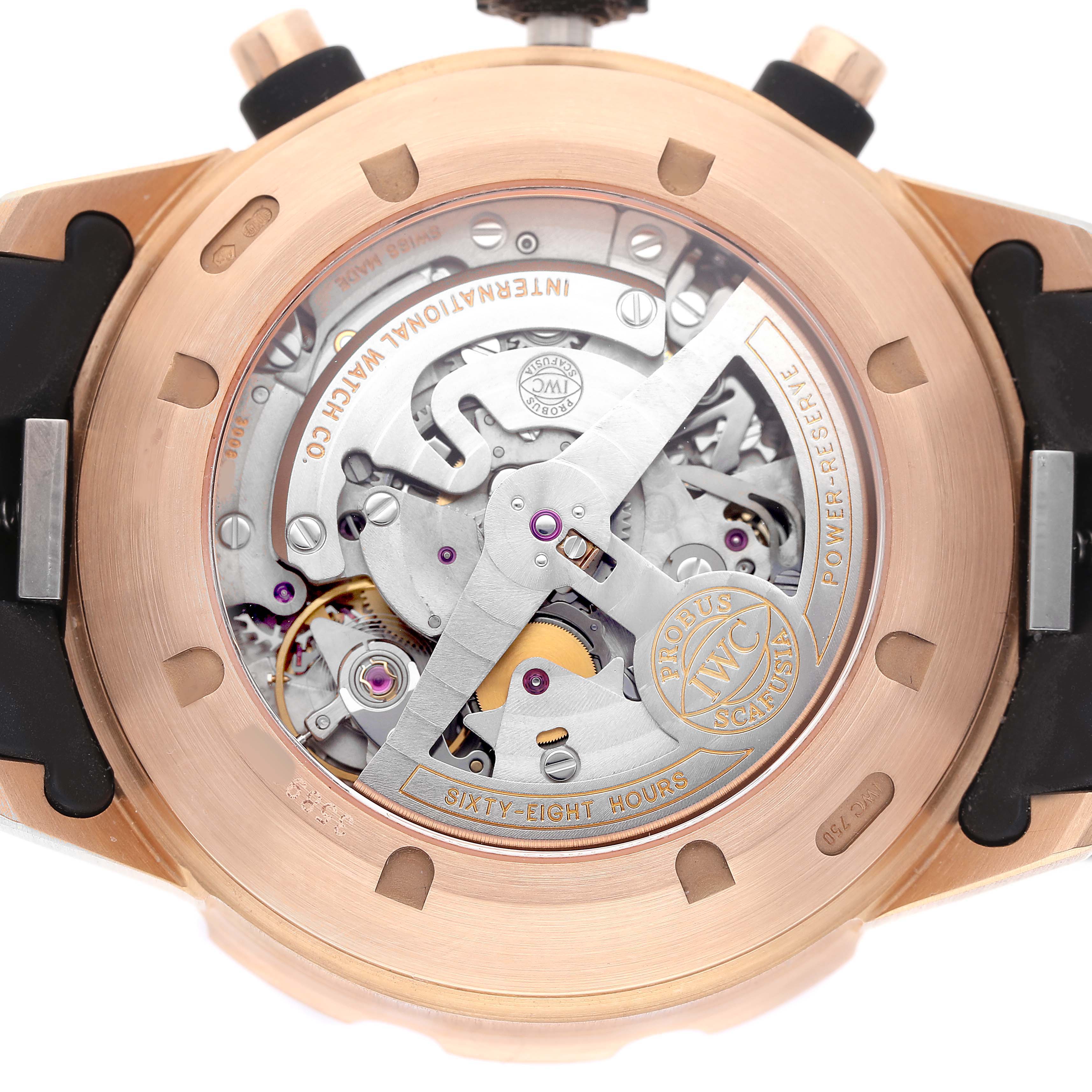 The image shows the back of the IWC Aquatimer IW376903 Men's Rose Gold Black Dial watch, highlighting its exposed movement and internal mechanics.
