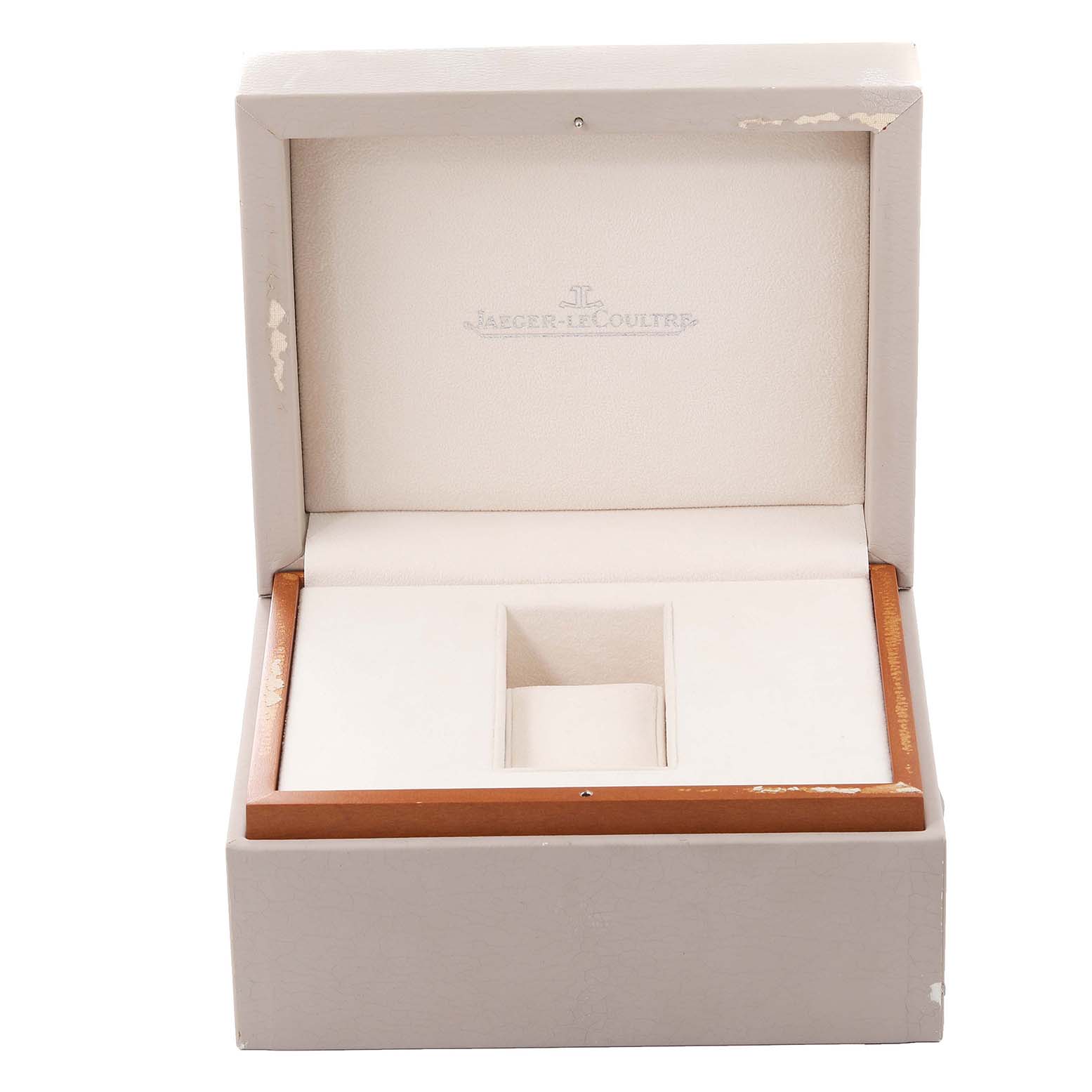 The image shows an empty watch box for the Jaeger-LeCoultre Reverso model, captured from a front angle.