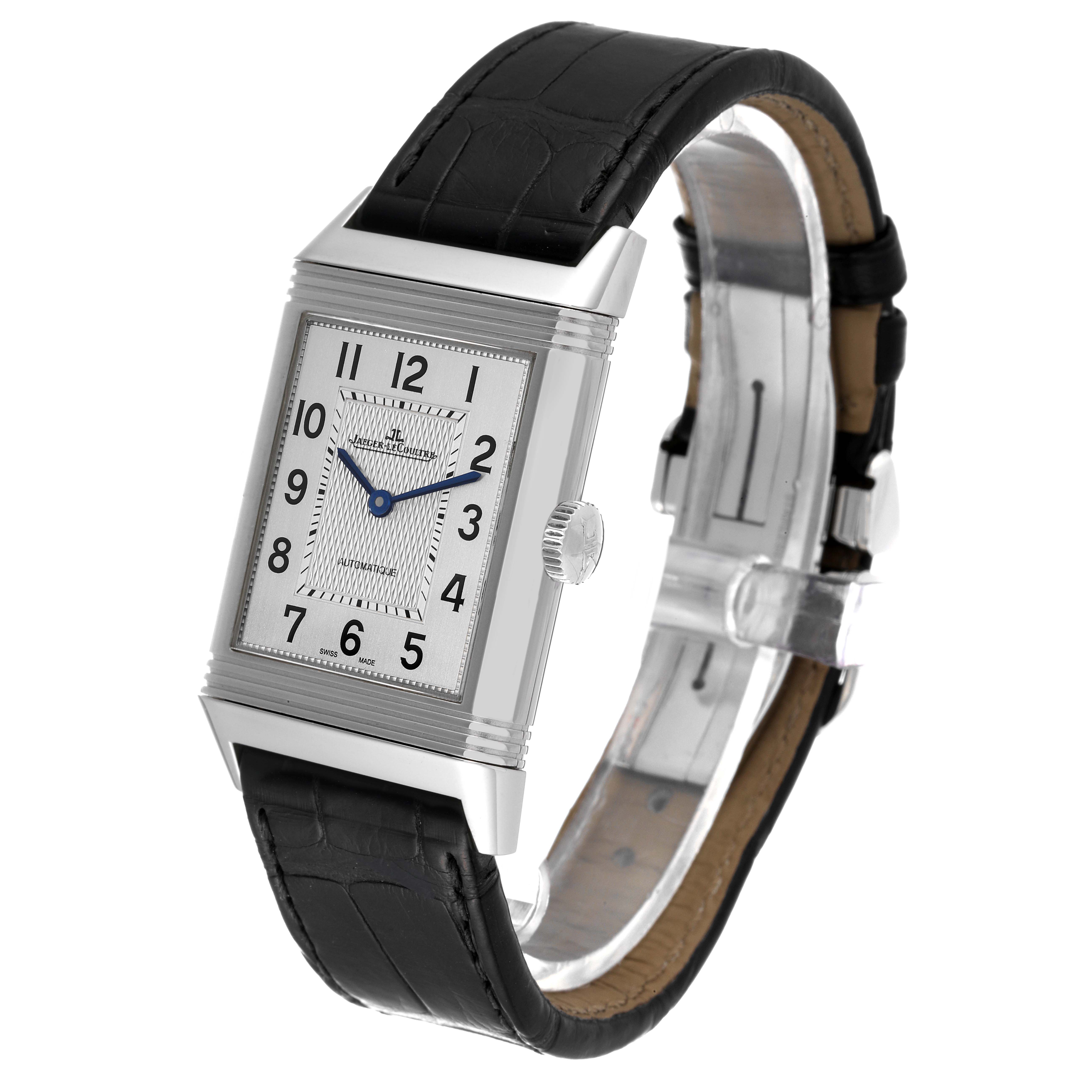 The Jaeger LeCoultre Reverso Q3828420 Men's Stainless Steel Silver Dial Q3828420 Men's Stainless Steel Silver Dial watch is shown at a three-quarter angle, highlighting its rectangular face, blue hands, and black leather strap.
