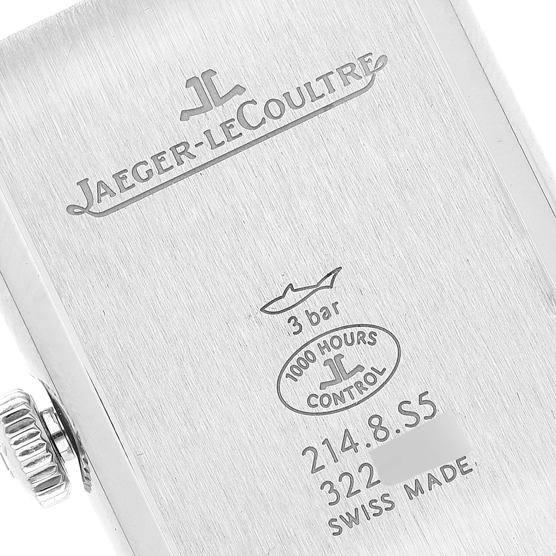 The image shows the detailed back casing of a Jaeger-LeCoultre Reverso watch, featuring branding, model number, and specifications.