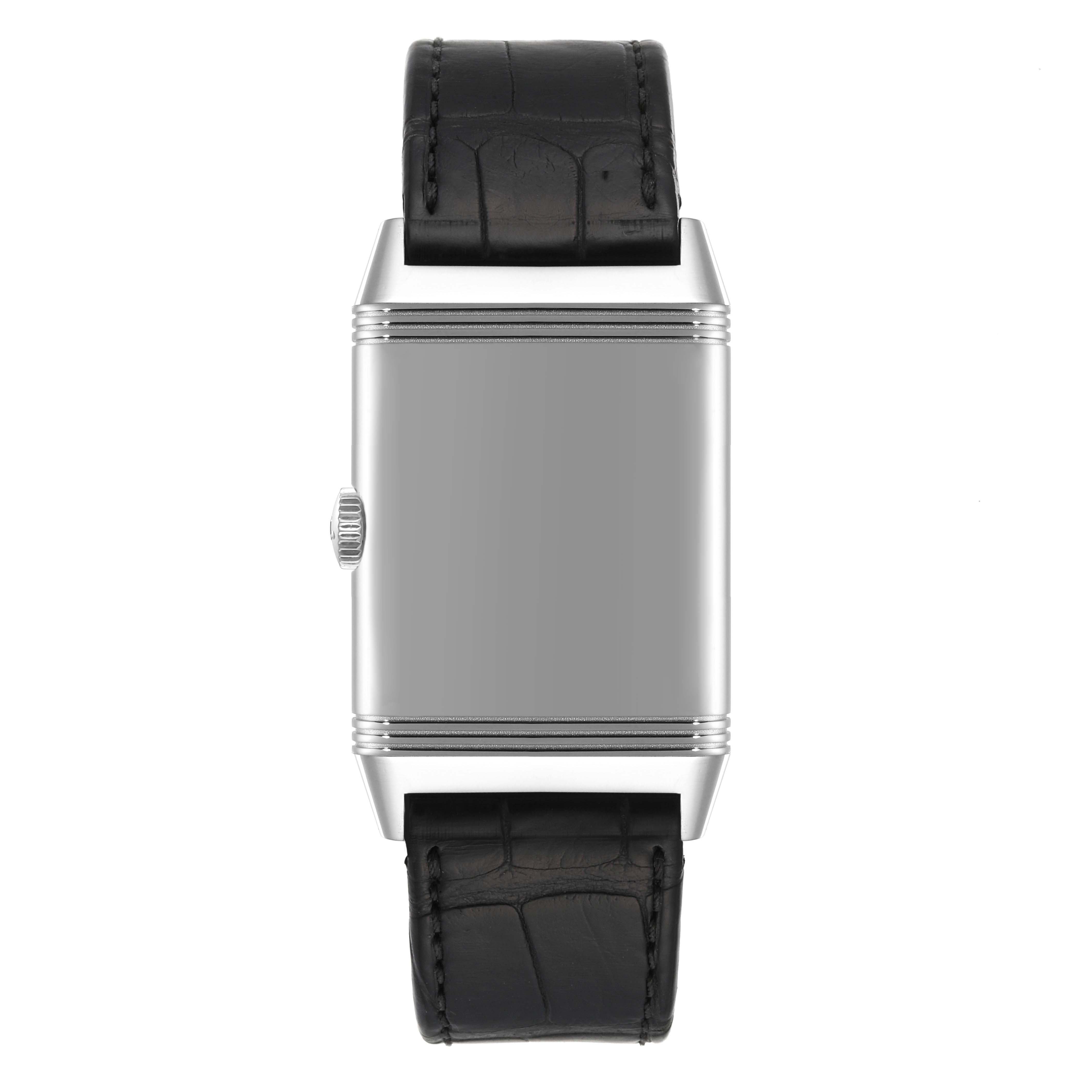 The image shows a Jaeger LeCoultre Reverso Q3828420 Men's Stainless Steel Silver Dial Q3828420 Men's Stainless Steel Silver Dial watch from a front angle, showcasing its case, crown, and leather strap.