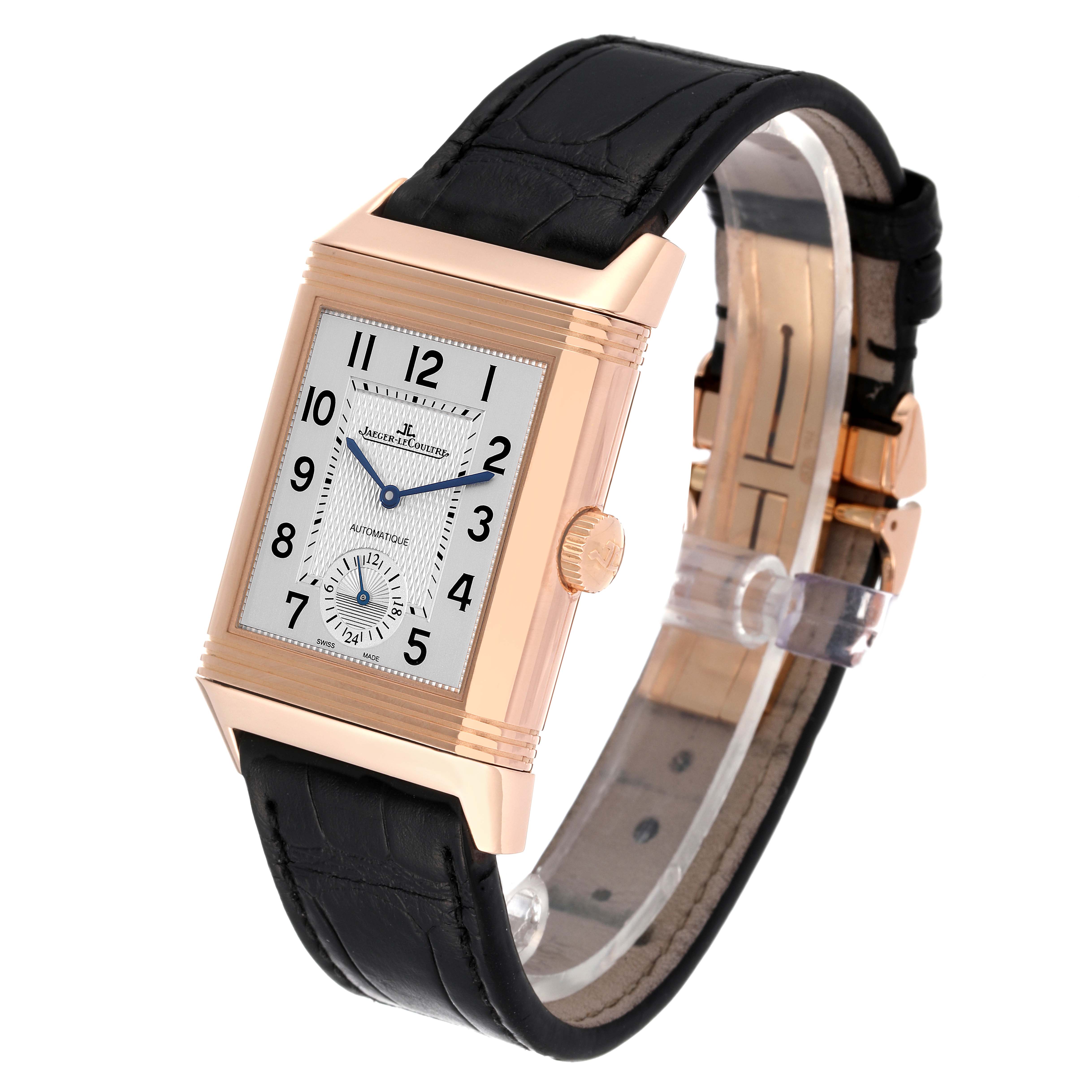 The Jaeger LeCoultre Reverso Q3832420 Men's Rose Gold Silver Dial Q3832420 Men's Rose Gold Silver Dial watch is shown at a slight angle, highlighting its face, case, and black leather strap.