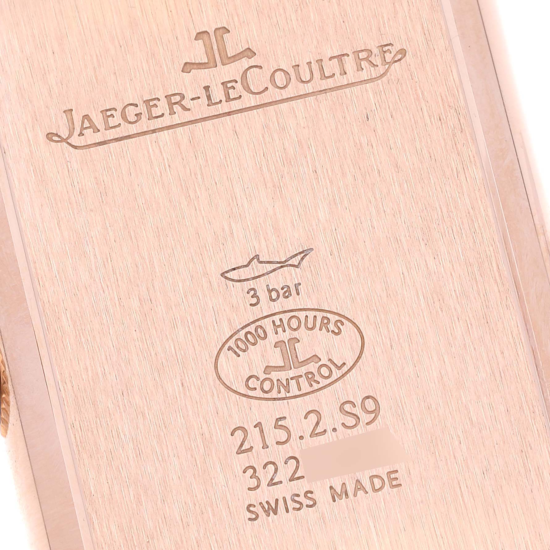 This image shows the back case of a Jaeger-LeCoultre Reverso watch, featuring its branding and specifications.