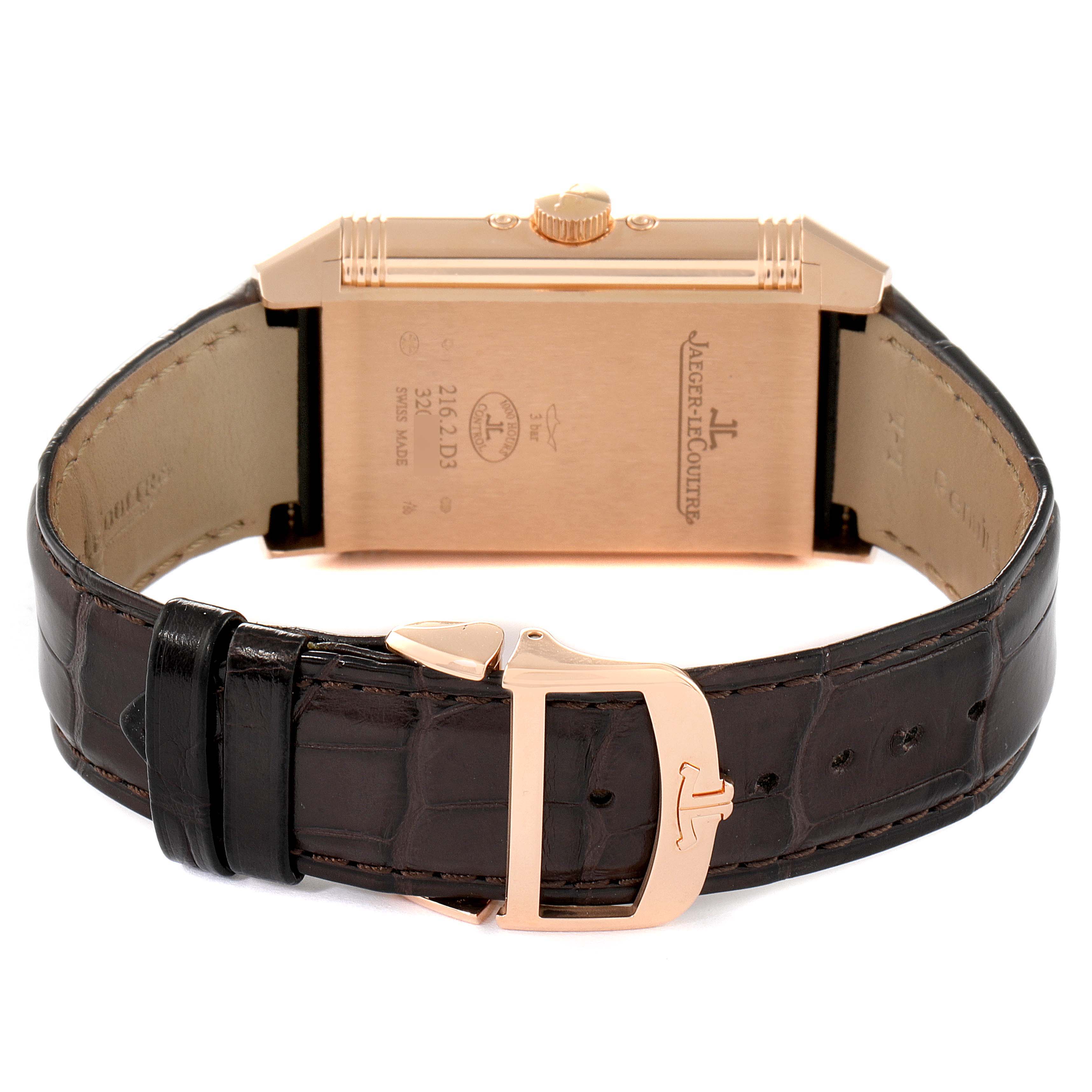 This image shows the back side of a Jaeger-LeCoultre Reverso watch, including the case, strap, buckle, and crown.