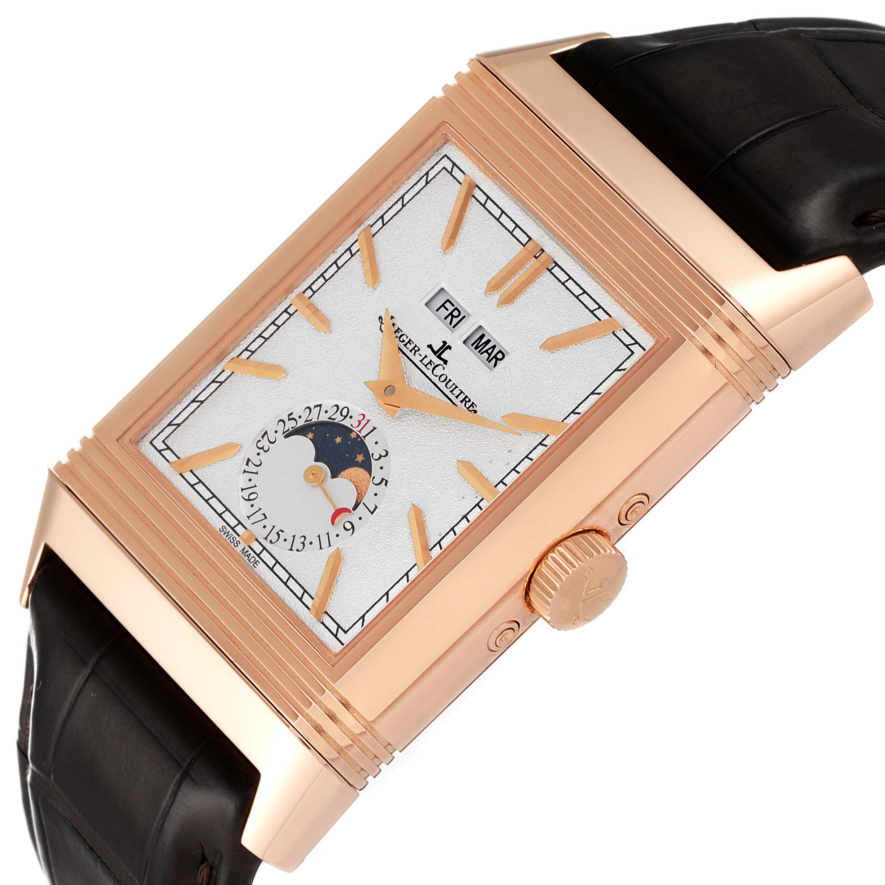 The image shows a Jaeger-LeCoultre Reverso watch at an angled view, highlighting its rectangular face, crown, and leather strap.