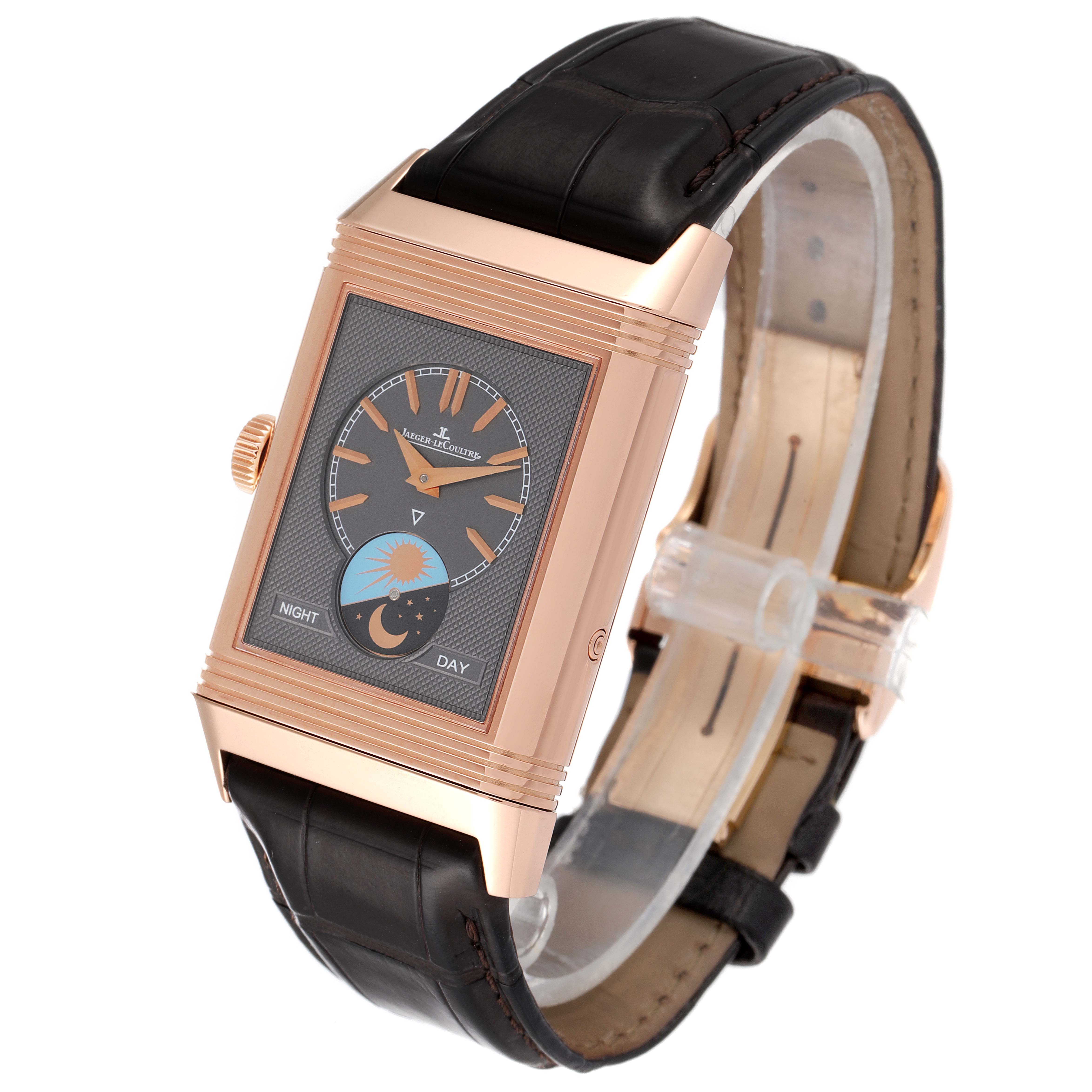 The Jaeger LeCoultre Reverso Q3912420 Men
s Rose Gold Silver Dial Q3912420 Men
s Rose Gold Silver Dial watch is shown at a three-quarter angle, displaying the dial, the crown, and the leather strap.