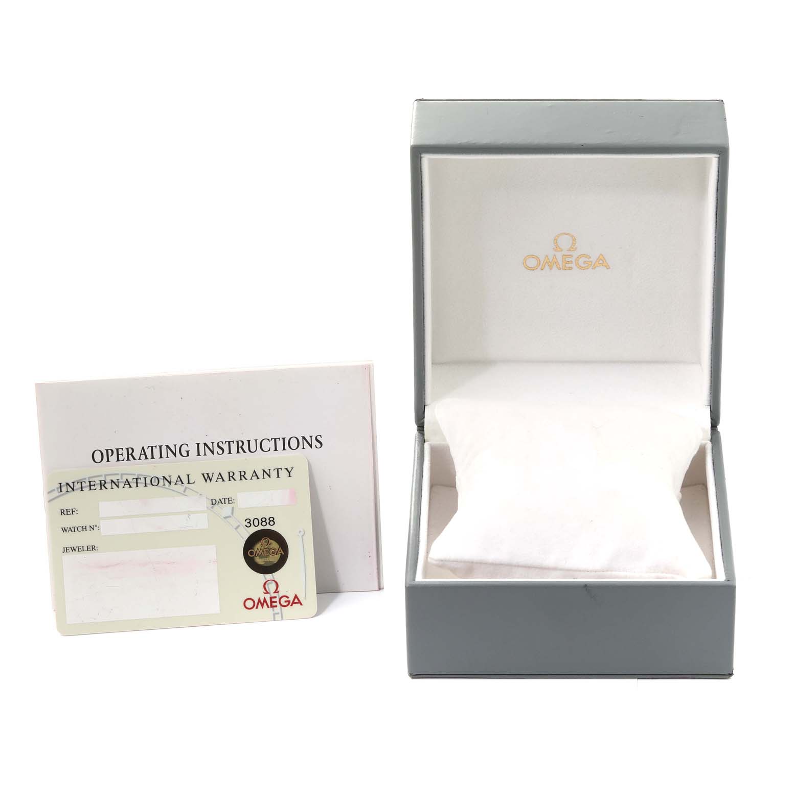 The image shows the Omega 2583.80.00 Women's Stainless Steel Blue Dial 2583.80.00 Women's Stainless Steel Blue Dial Seamaster Diver 300M 28mm Steel Ladies Watch 2583.80.00 box, along with the operating instructions and warranty card.