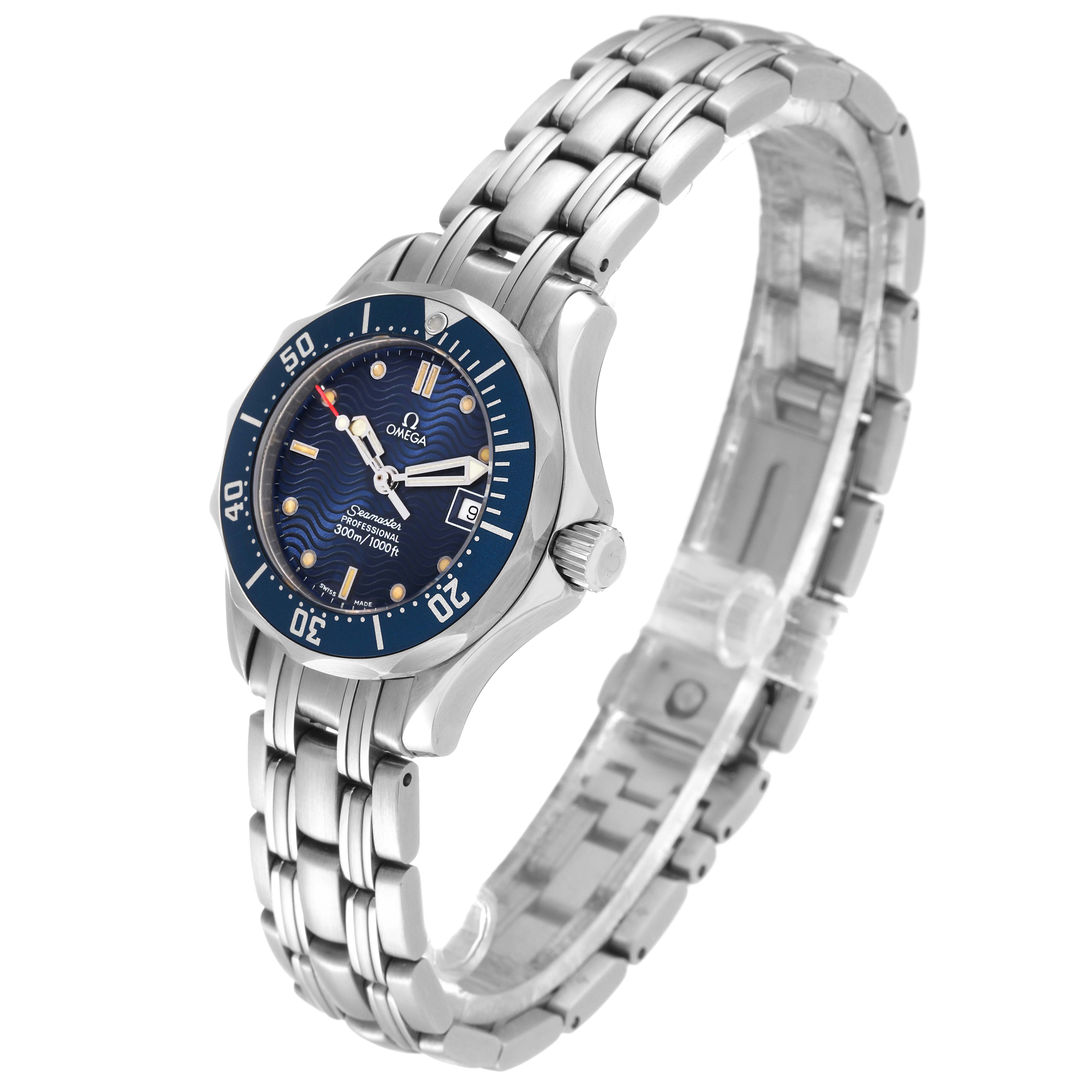 The image shows a side-angle view of the Omega 2583.80.00 Women's Stainless Steel Blue Dial 2583.80.00 Women's Stainless Steel Blue Dial Seamaster Diver 300M 28mm Steel Ladies Watch model 2583.80.00, focusing on its dial and bracelet.