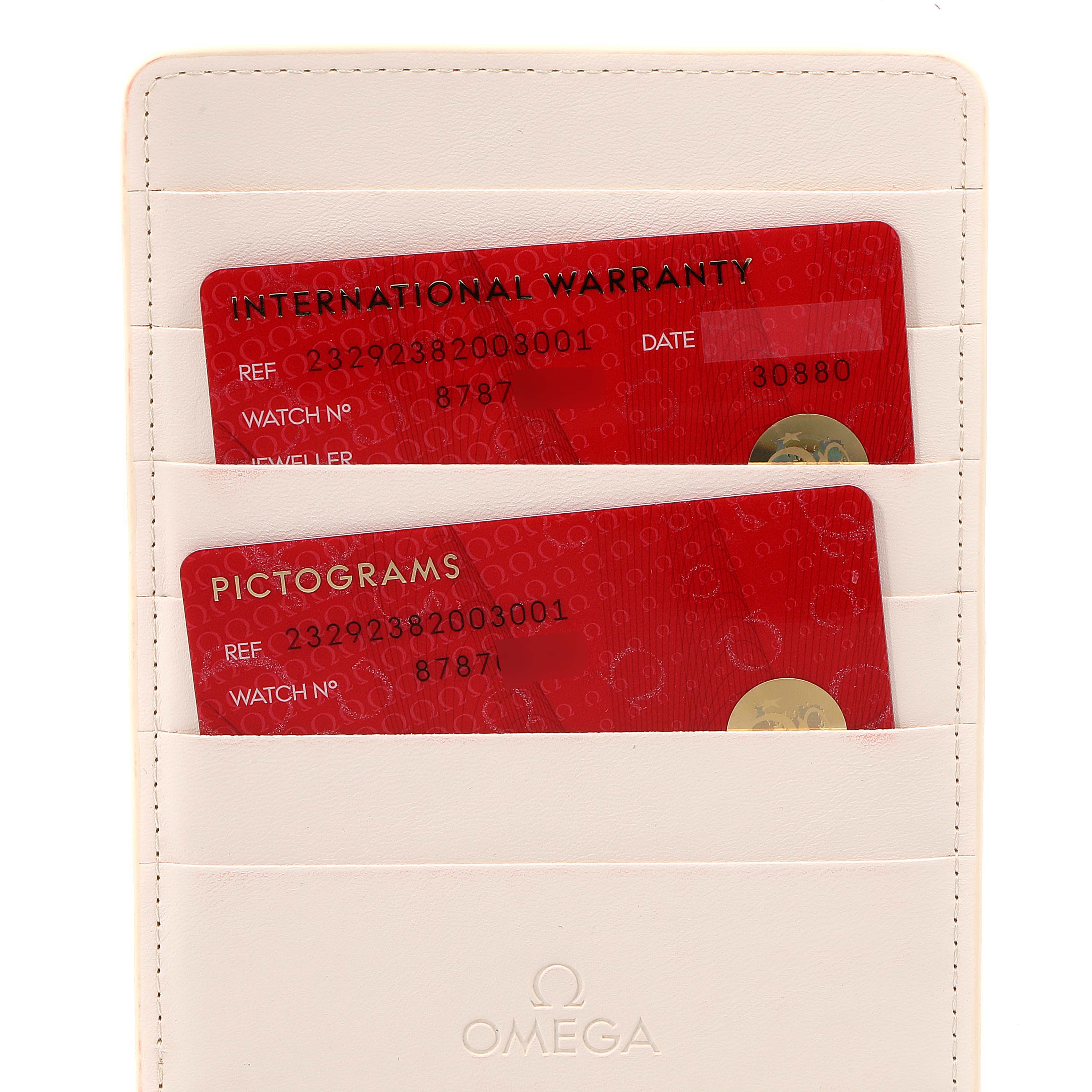 The image shows warranty and pictogram cards for the Omega Planet Ocean 232.92.38.20.03.001 Men's Titanium Blue Dial 232.92.38.20.03.001 Men's Titanium Blue Dial watch, stored in an Omega-branded cardholder.