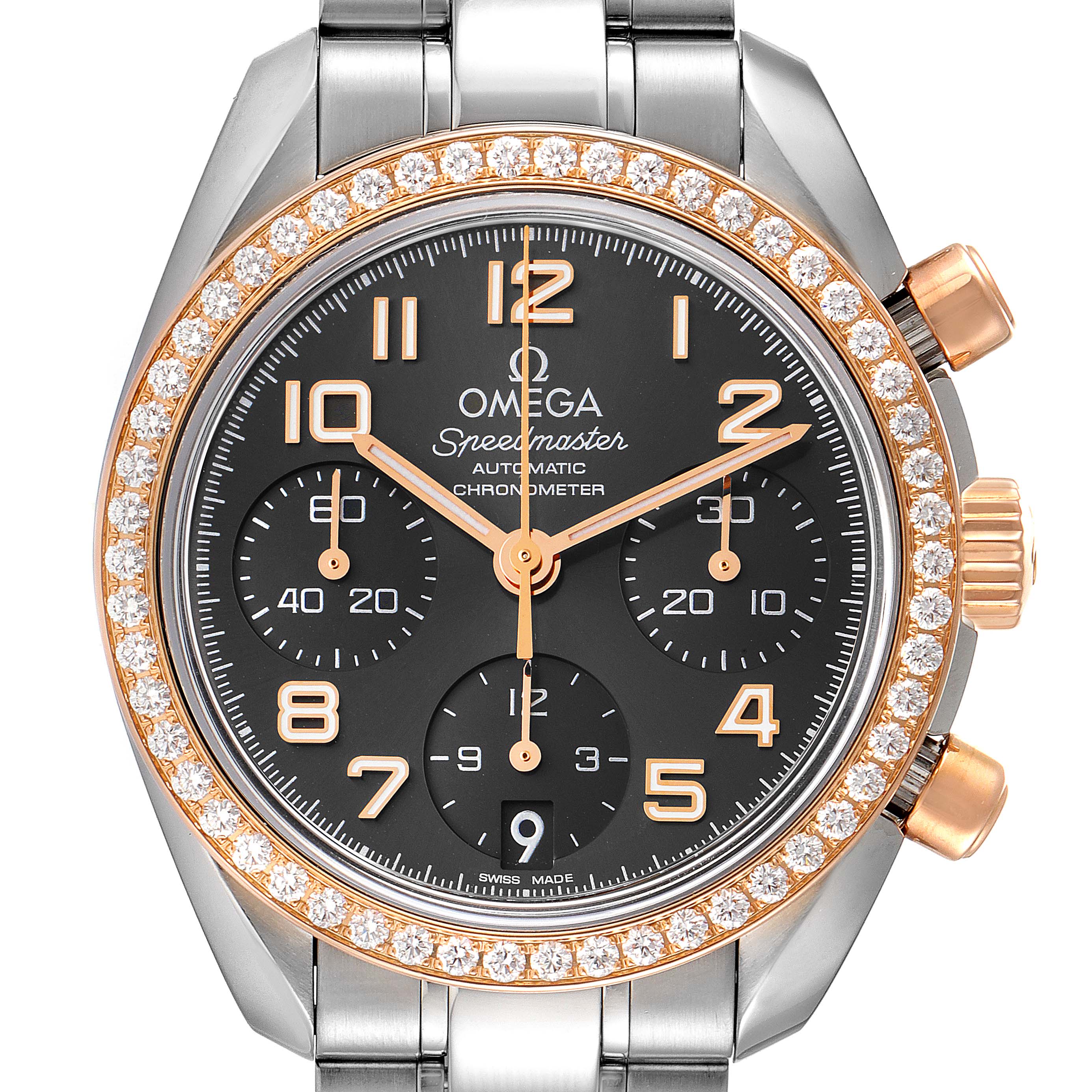 The image shows a close-up of an Omega Speedmaster 324.28.38.40.06.001 Men's Steel and Gold (two tone) Grey Dial 324.28.38.40.06.001 Men's Steel and Gold (two tone) Grey Dial watch, featuring its dial, bezel with diamonds, and chronograph functions.