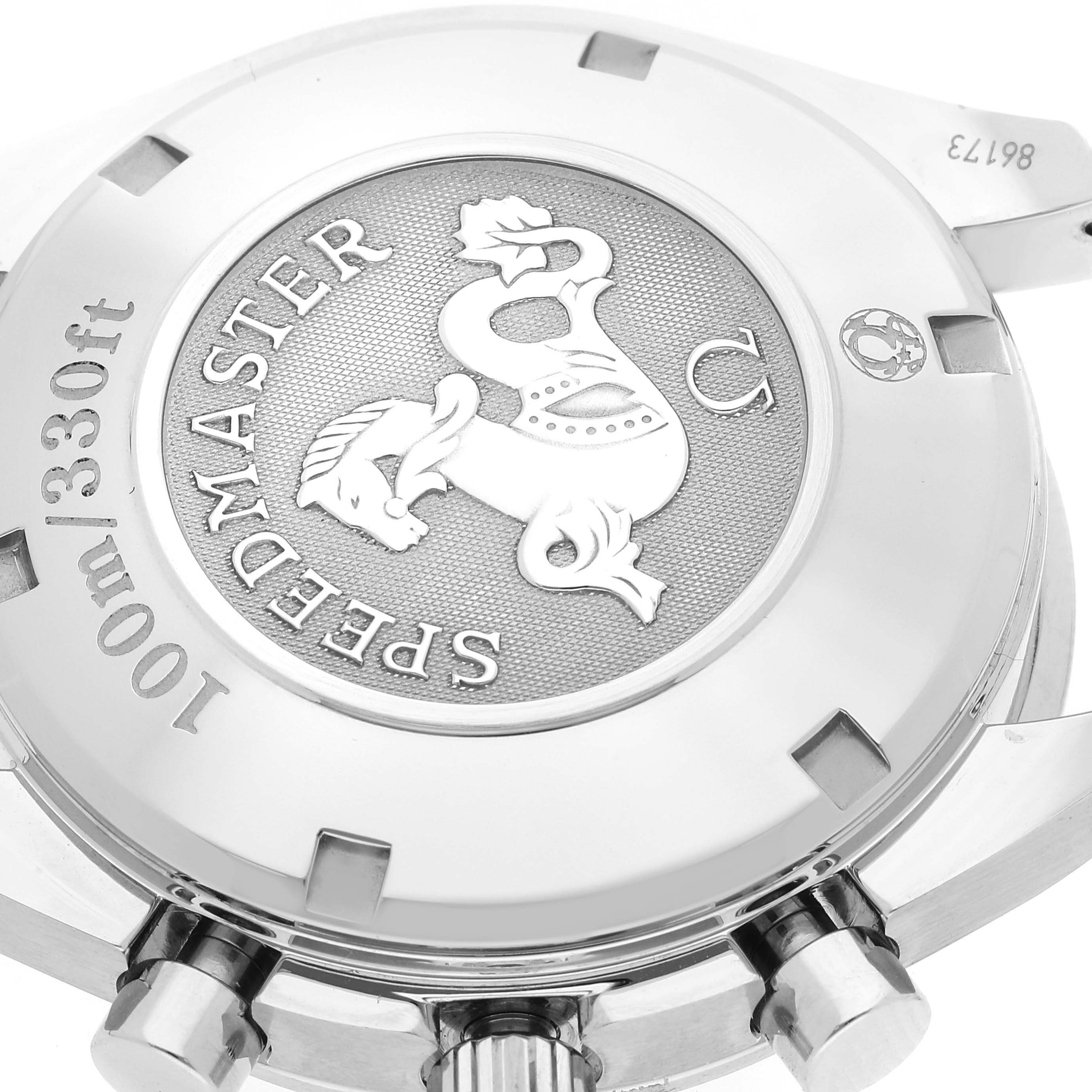 The image shows the case back and pushers of an Omega Speedmaster 323.30.40.40.06.001 Men's Stainless Steel Grey Dial 323.30.40.40.06.001 Men's Stainless Steel Grey Dial watch.