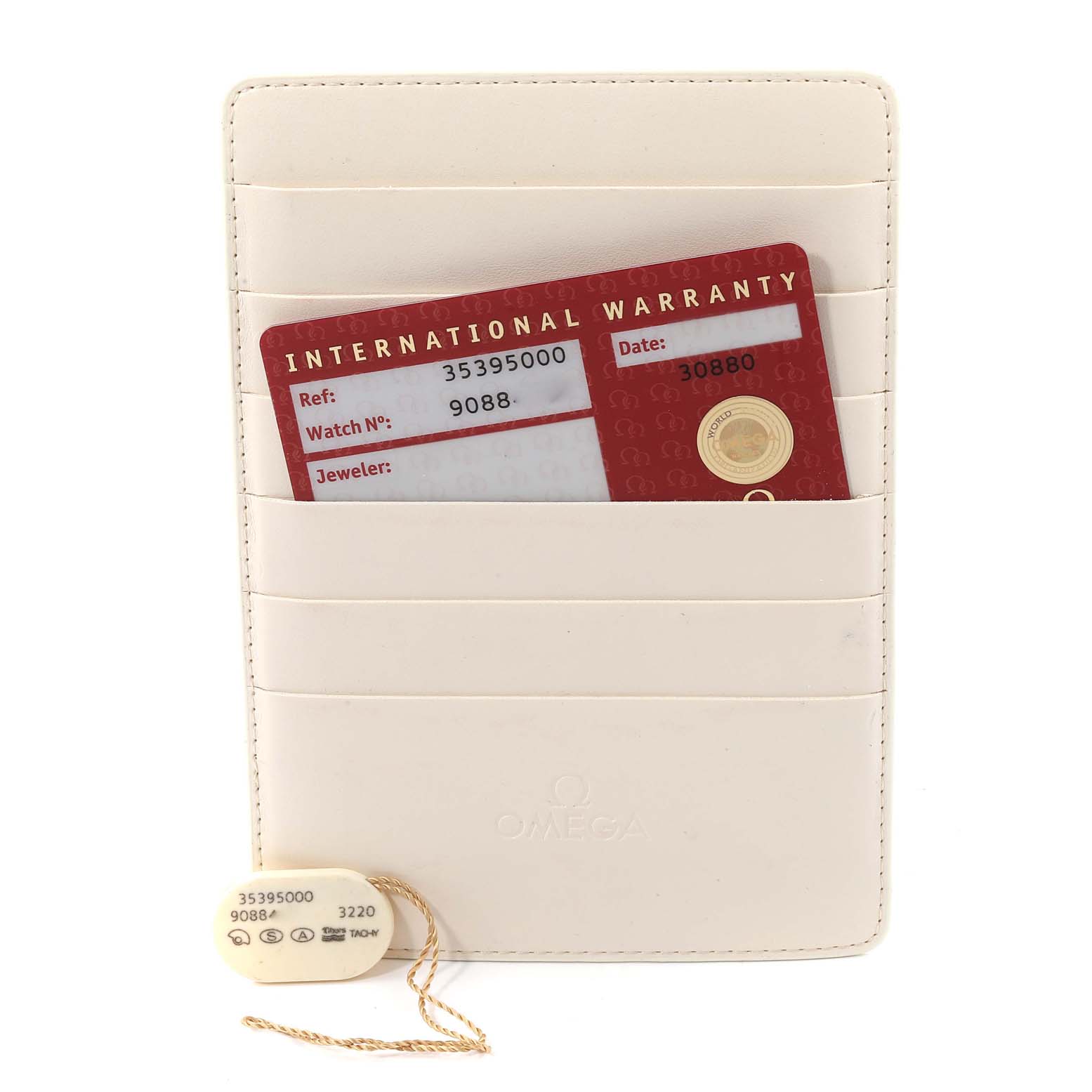 The image shows an Omega Speedmaster 3539.50.00 Men's Stainless Steel Black Dial 3539.50.00 Men's Stainless Steel Black Dial international warranty card and tag within a white Omega cardholder.