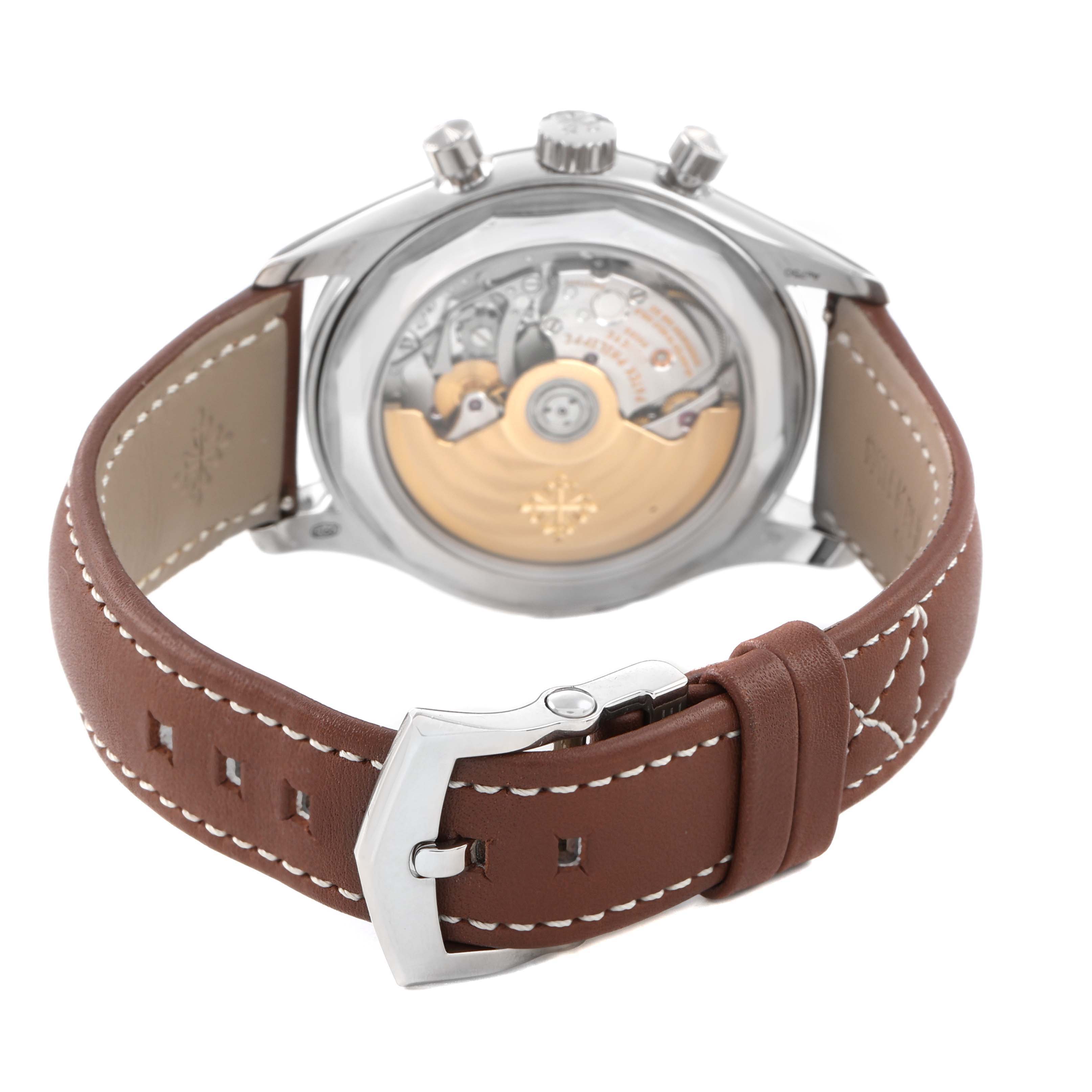 The image shows the back view of a Patek Philippe Complications 5960 Men's White Gold Blue Dial watch, highlighting the movement and brown leather strap with a buckle.