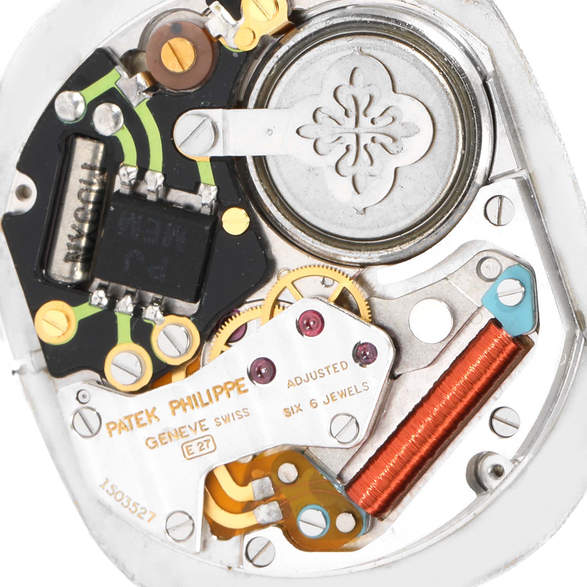 The image shows a close-up view of the internal mechanism of the Patek Philippe Golden Ellipse 3838/1 Men's Yellow Gold Beige Dial 3838/1 Men's Yellow Gold Beige Dial watch, highlighting gears, circuits, and coils.