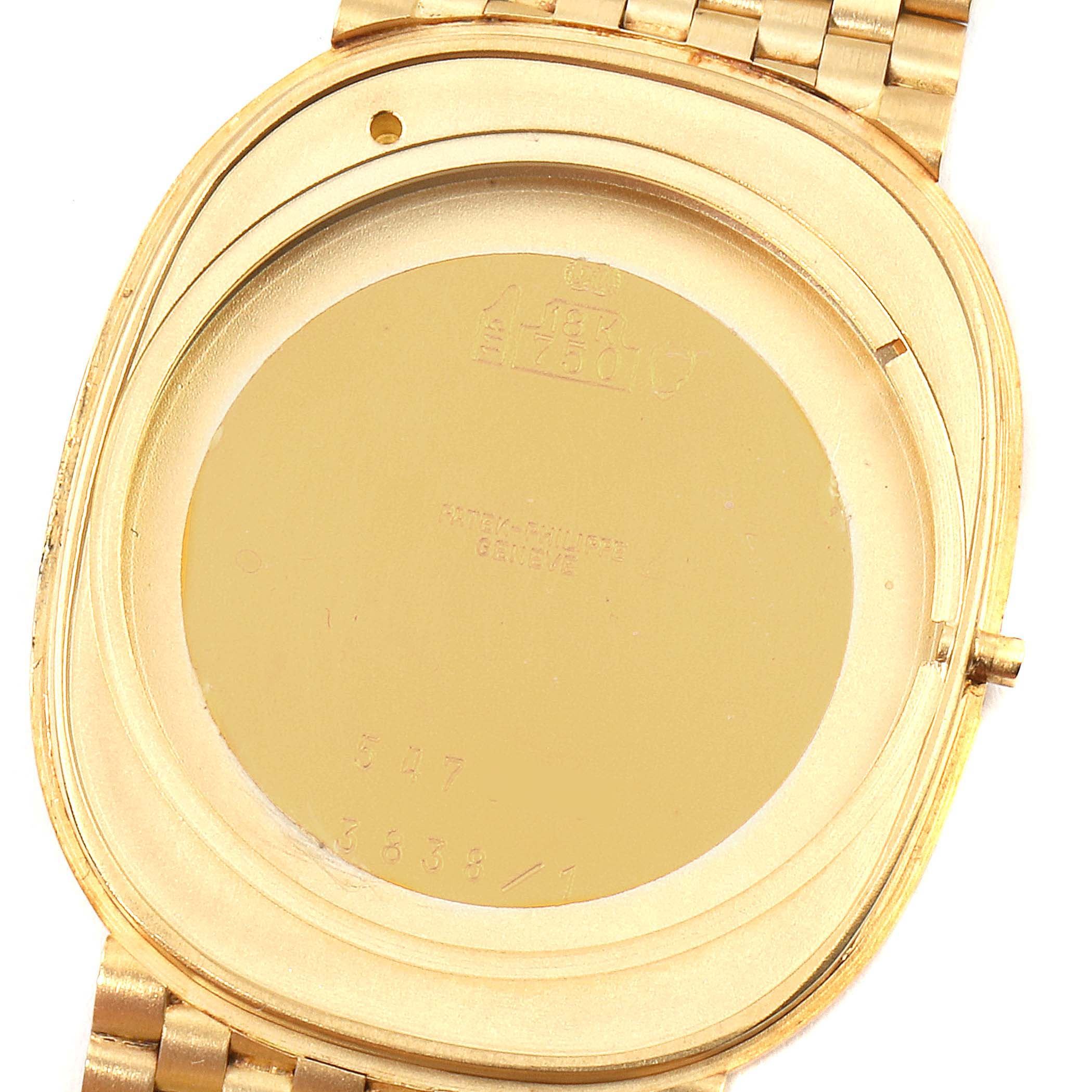 This image shows the back case of the Golden Ellipse model by Patek Philippe, including the engraved markings and part of the wristband.