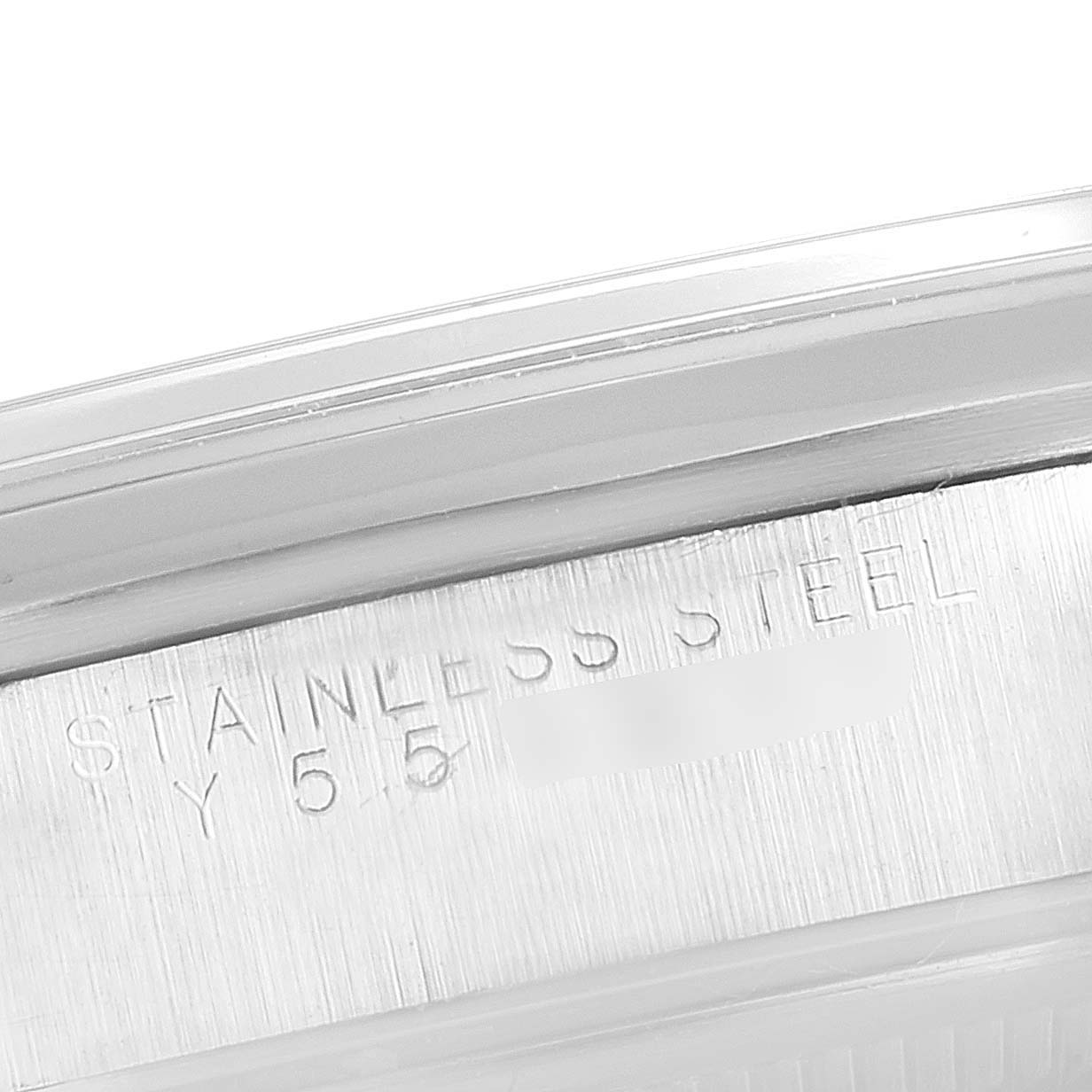 The close-up image shows part of the case back of a Rolex Air-King 14000 Men's Stainless Steel Black Dial 14000 Men's Stainless Steel Black Dial, highlighting the stainless steel engraving.